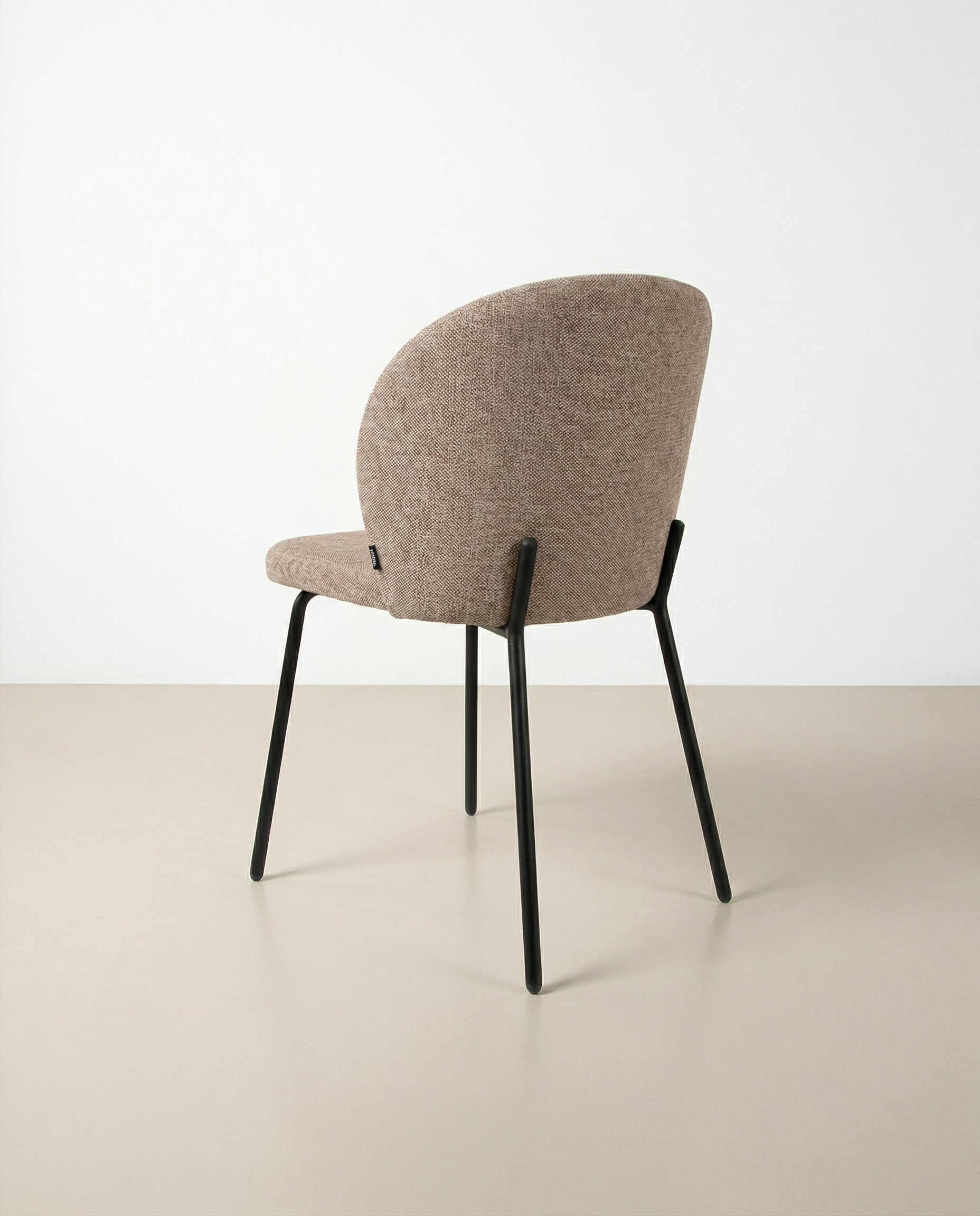 Bergen chair with brown upholstery and black metal legs