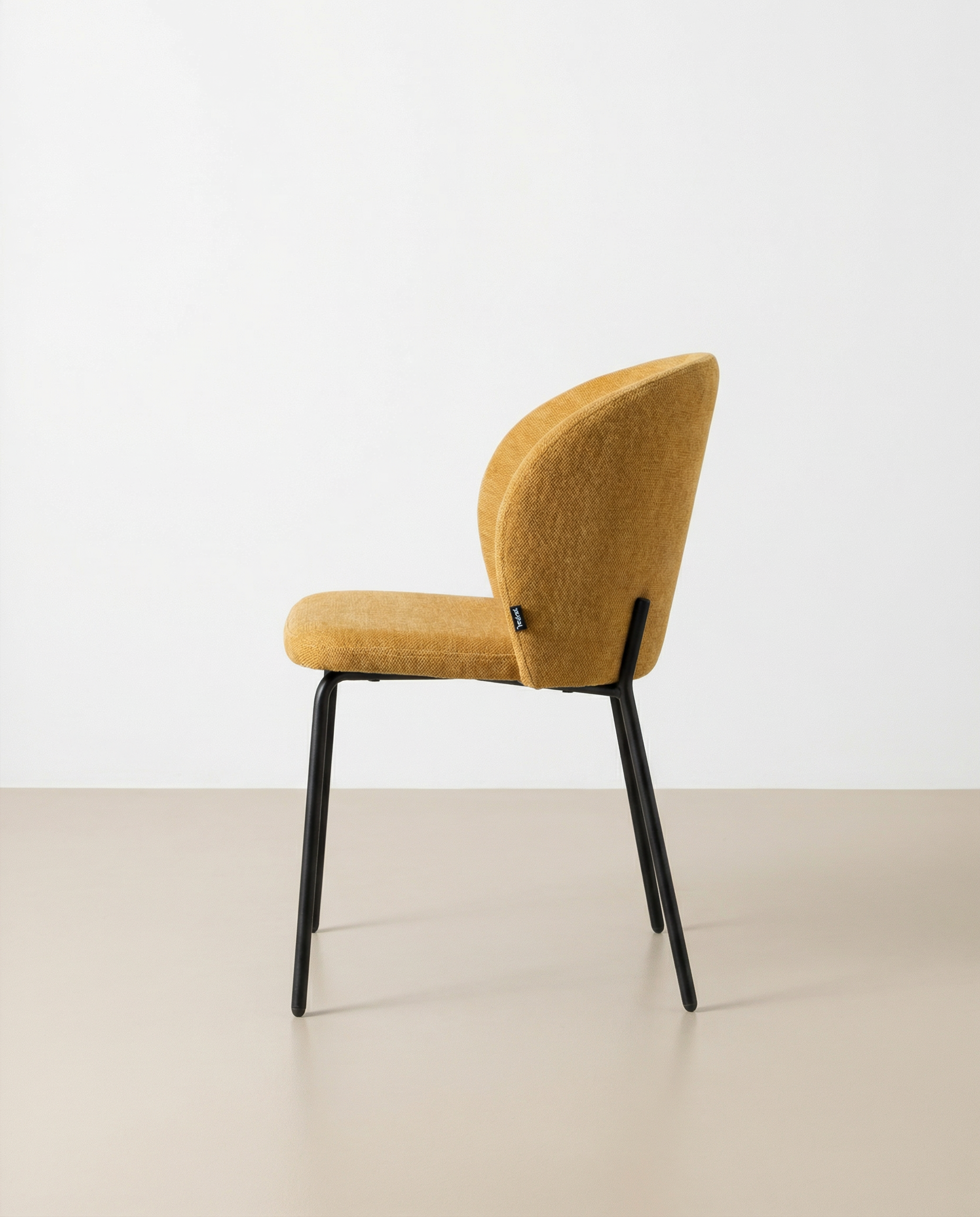 Bergen chair with mustard upholstery and black metal legs