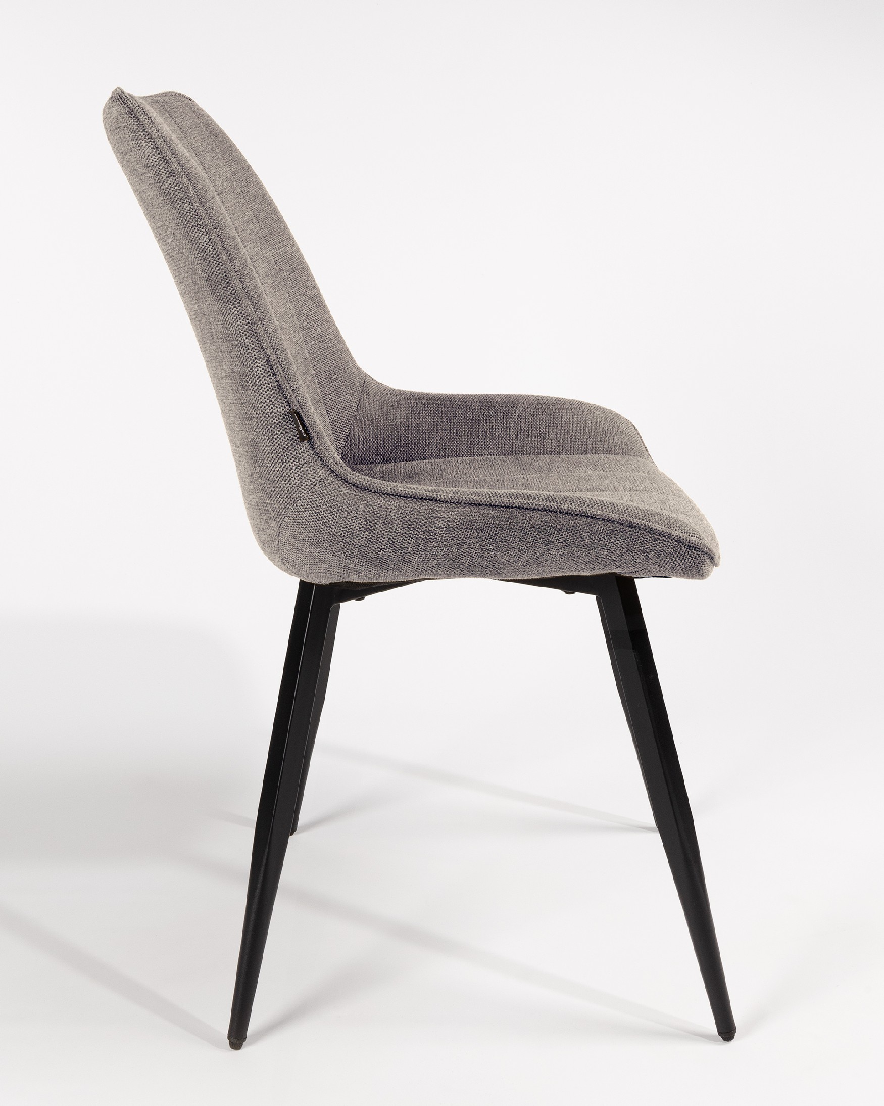 Ankara chair with gray upholstery and black legs