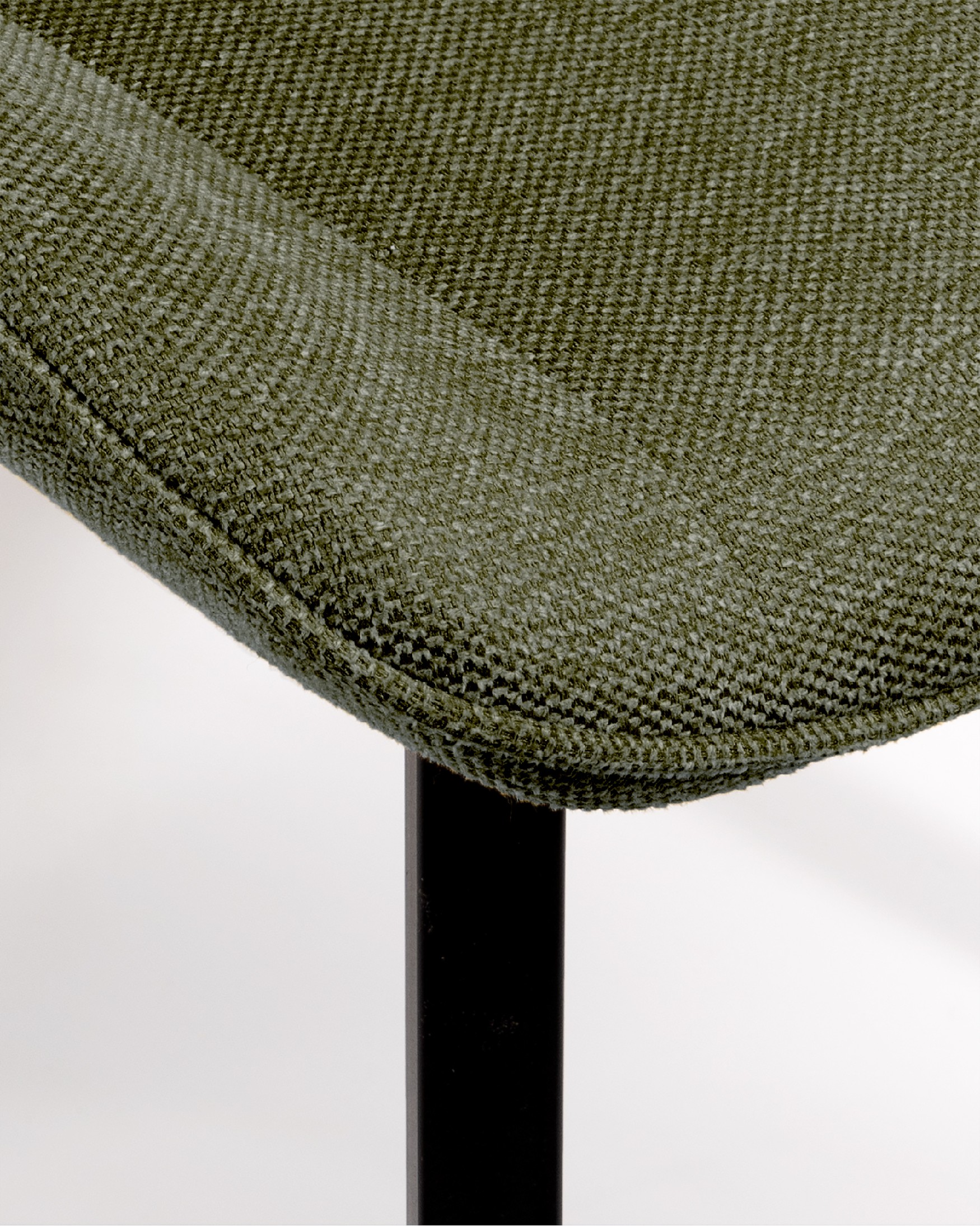 Ankara chair with green upholstery and black legs