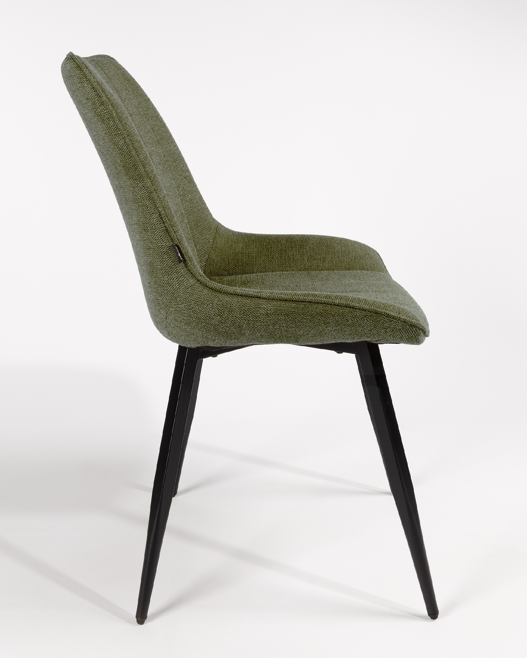 Ankara chair with green upholstery and black legs