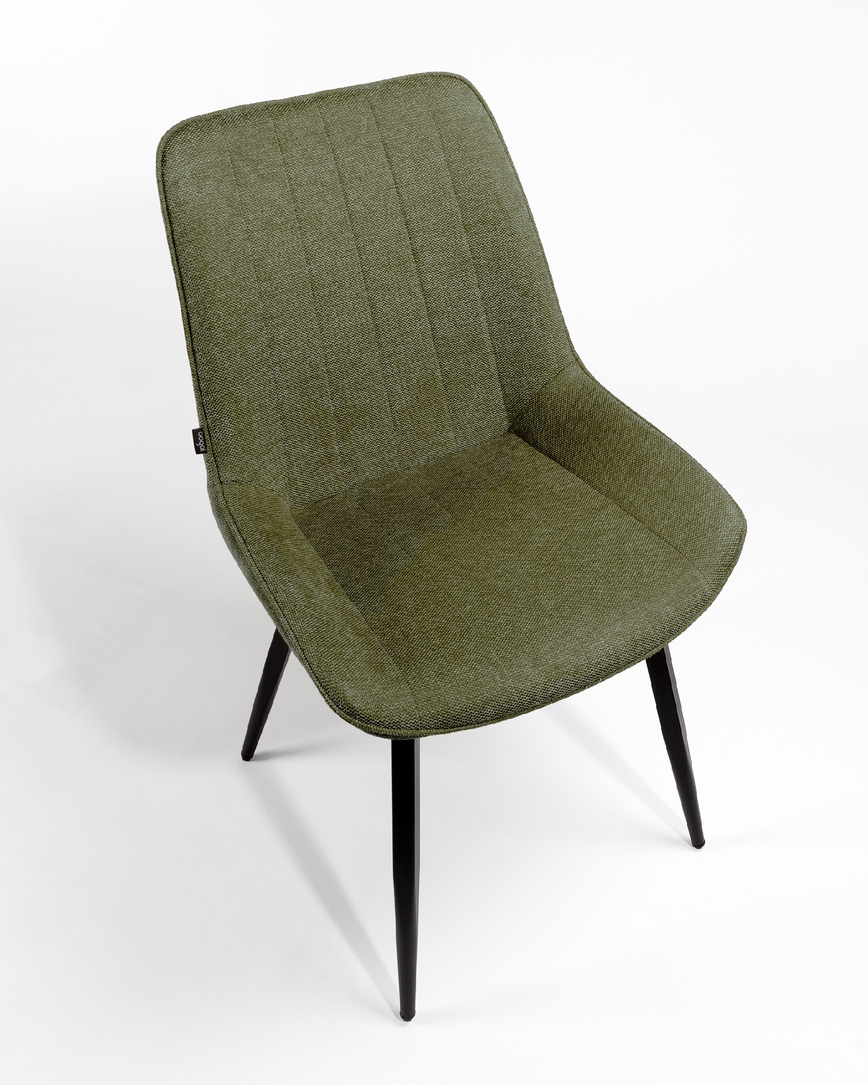 Ankara chair with green upholstery and black legs
