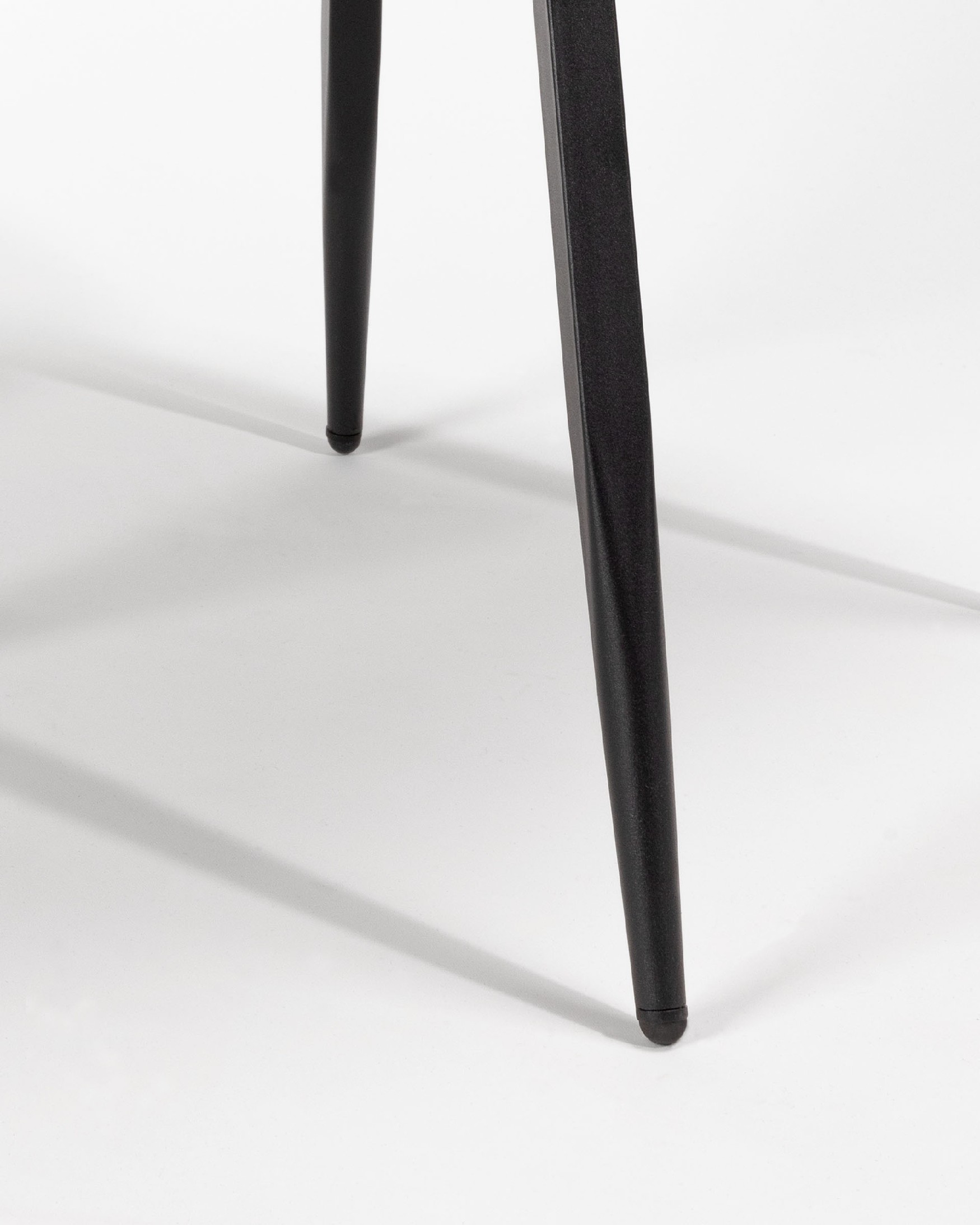 Chicago chair with dark gray upholstery and black metal legs