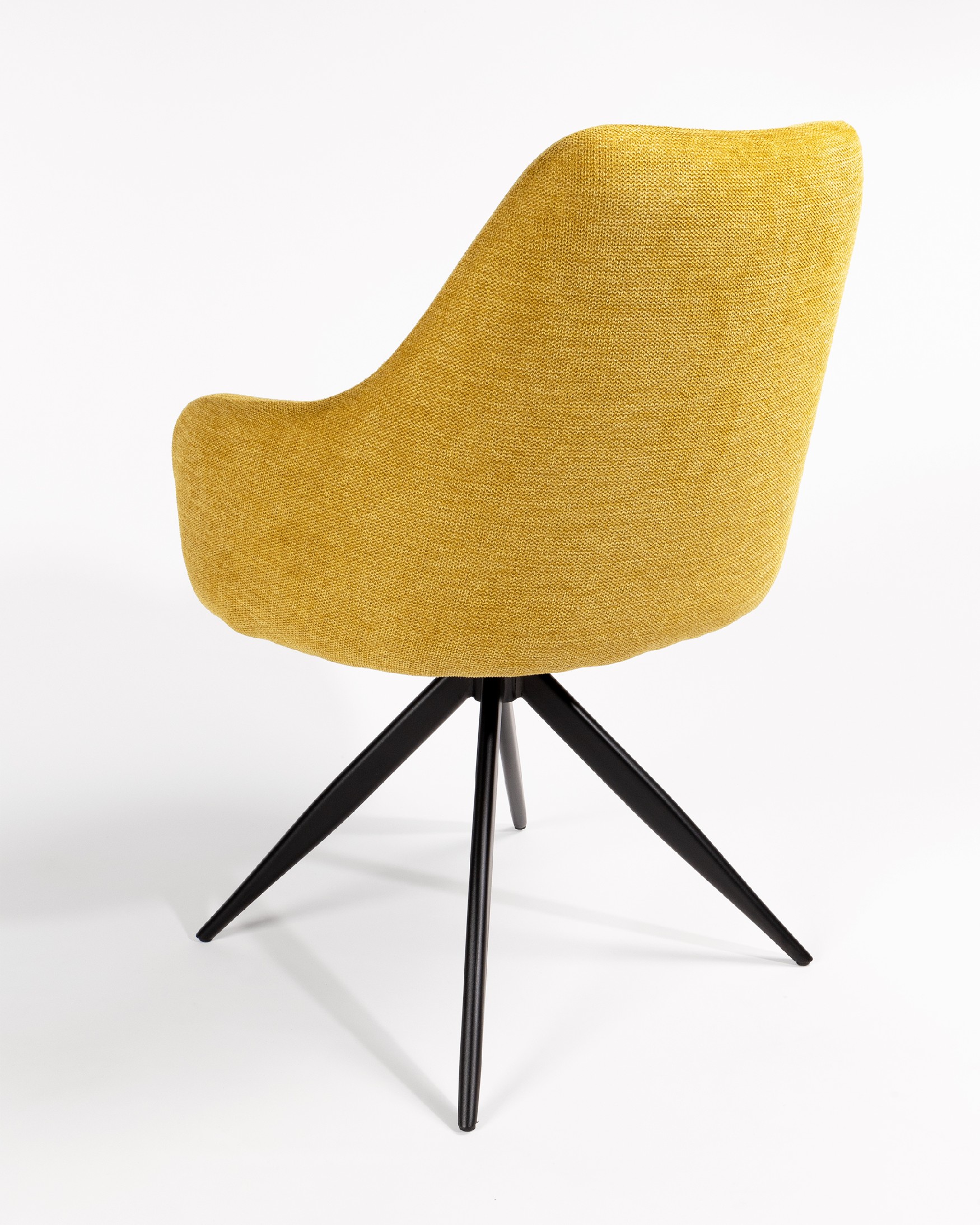 Montreal swivel chair 180º with return function, mustard upholstery, and black metal legs