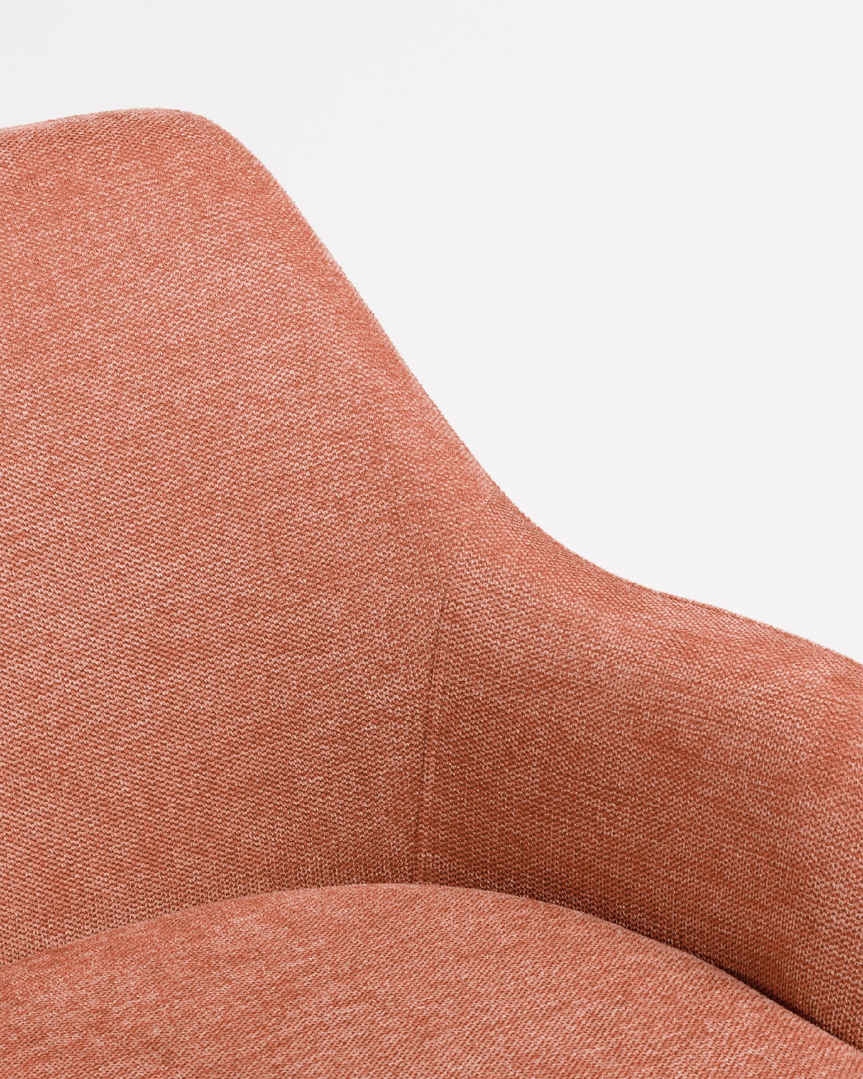 Silla Montreal giratoria 180º con función return, tapizado salmón y patas metálicas negras