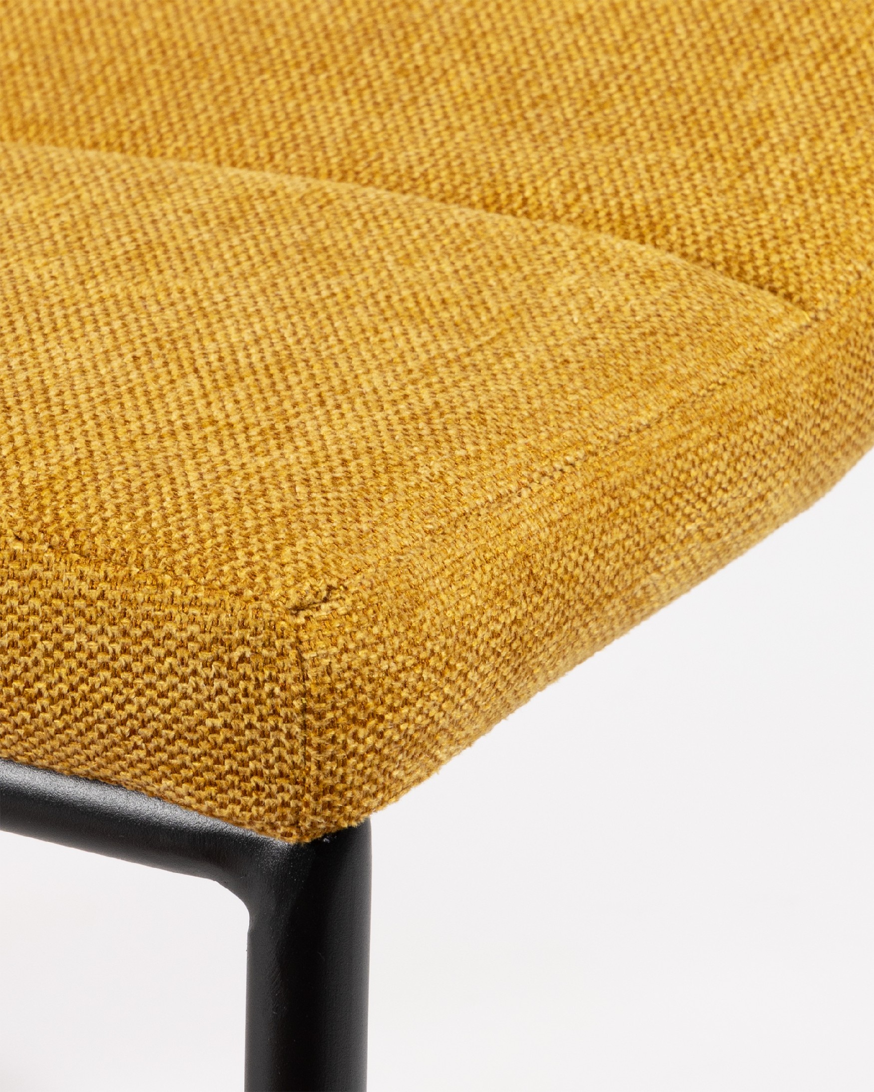 Niza chair with mustard upholstery and black metal legs