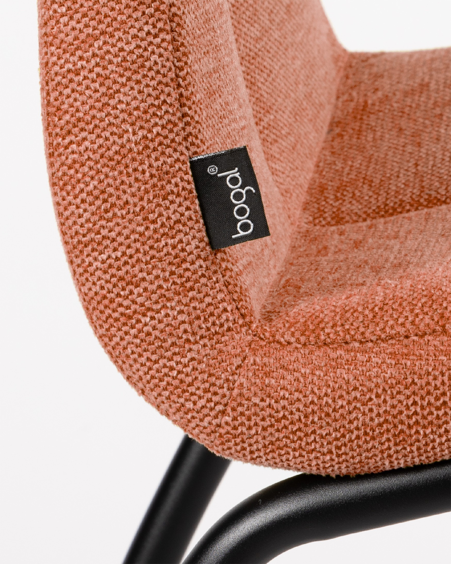 Niza chair with salmon upholstery and black metal legs