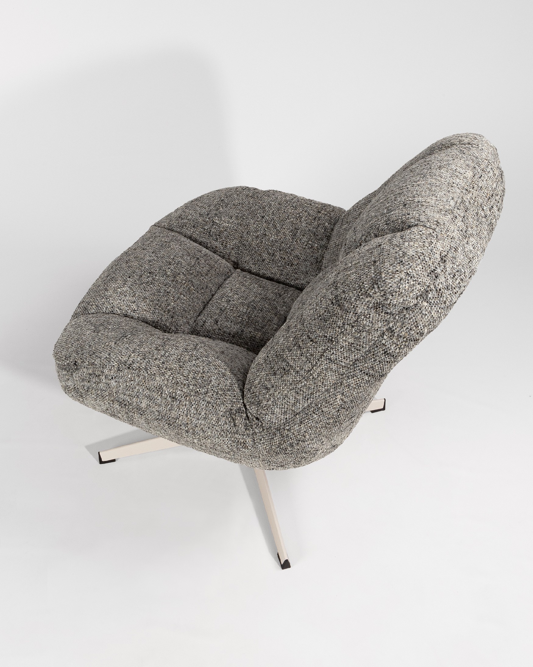 Nolia armchair with storm upholstery and ivory metal base, 360° swivel