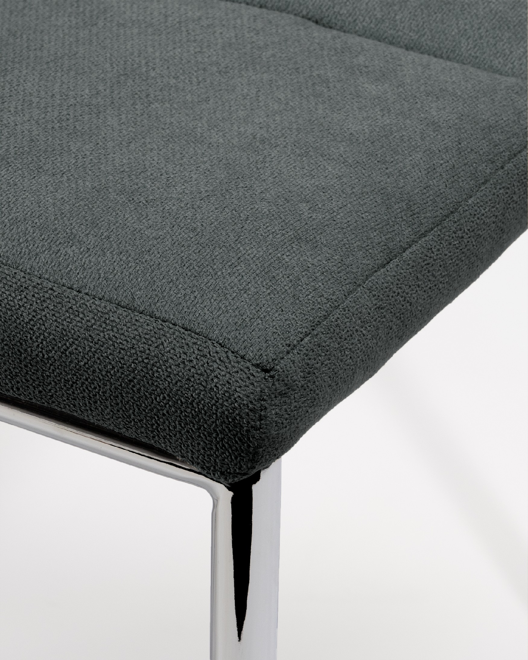 Zagreb chair with dark upholstery and chrome legs