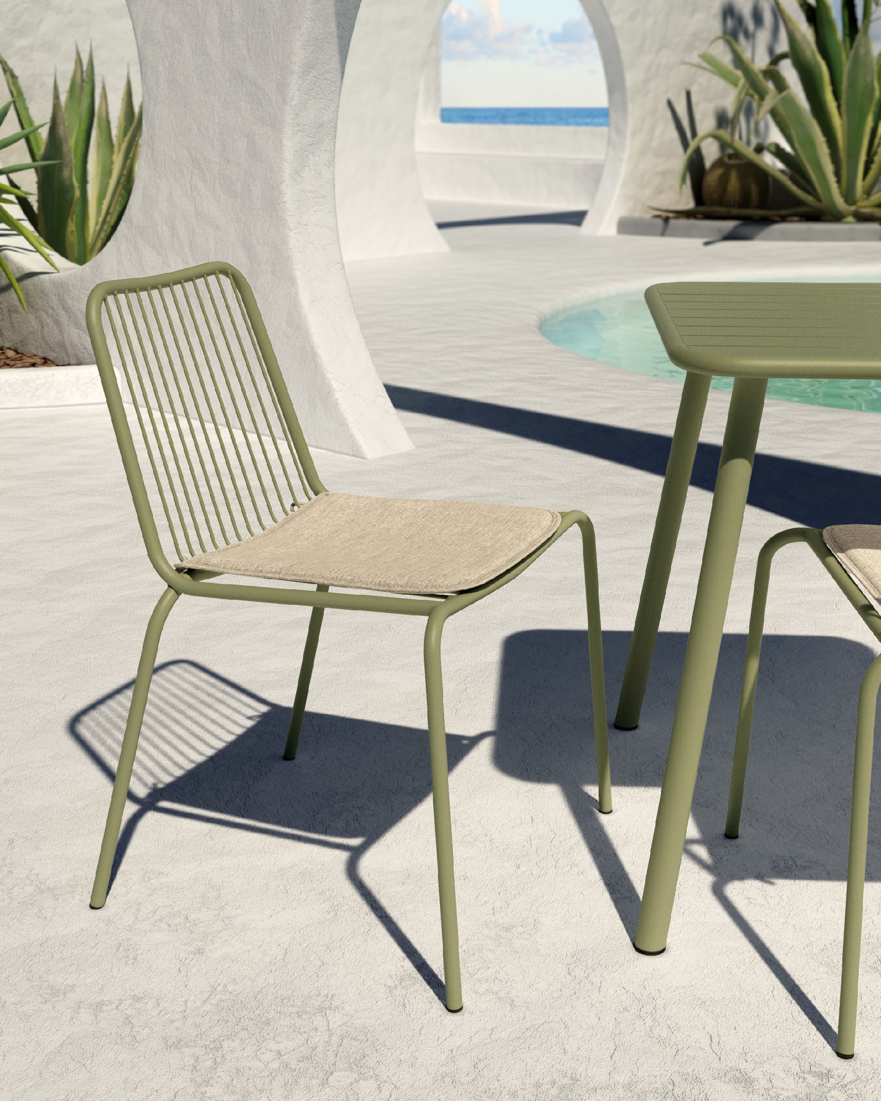Chaise Aloha en métal vert craie avec coussin