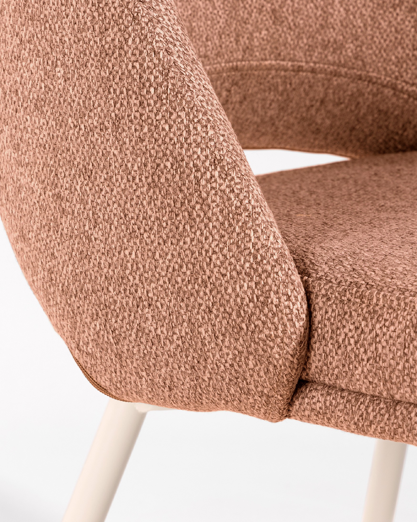 Aman chair with salmon upholstery and ivory metal legs