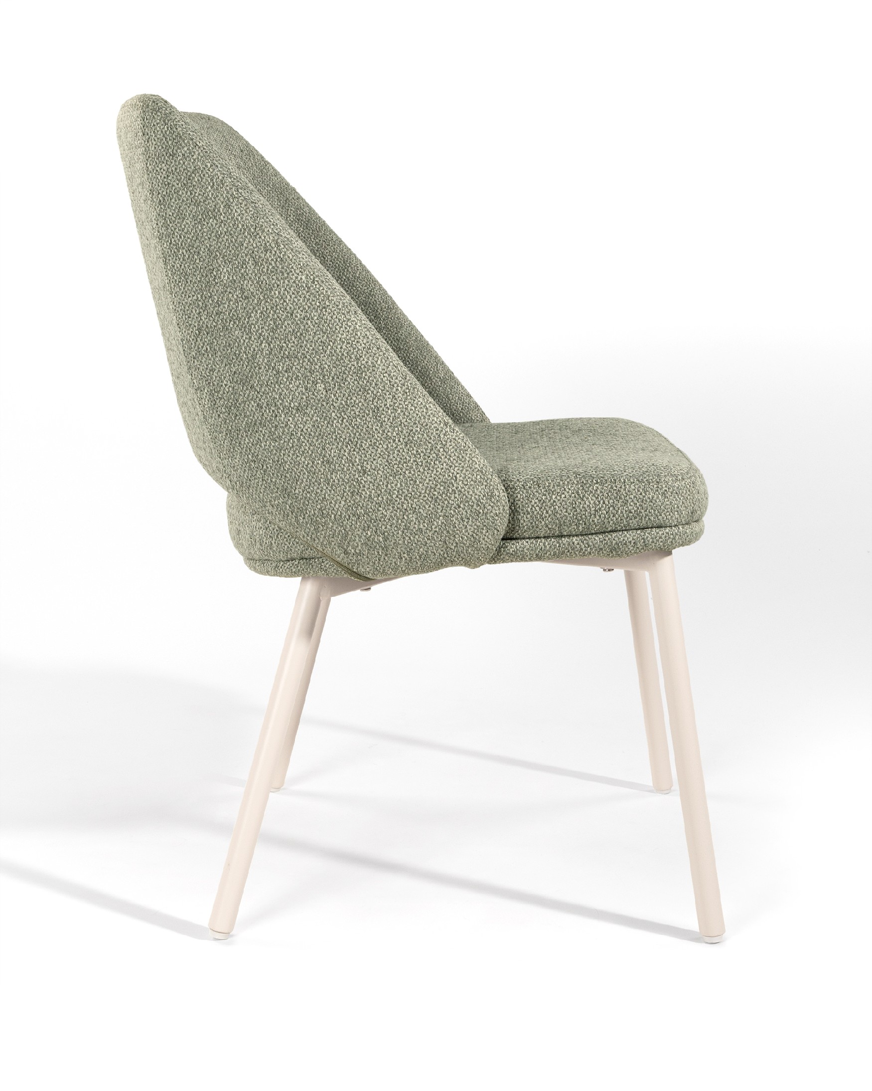 Aman chair with green upholstery and ivory metal legs
