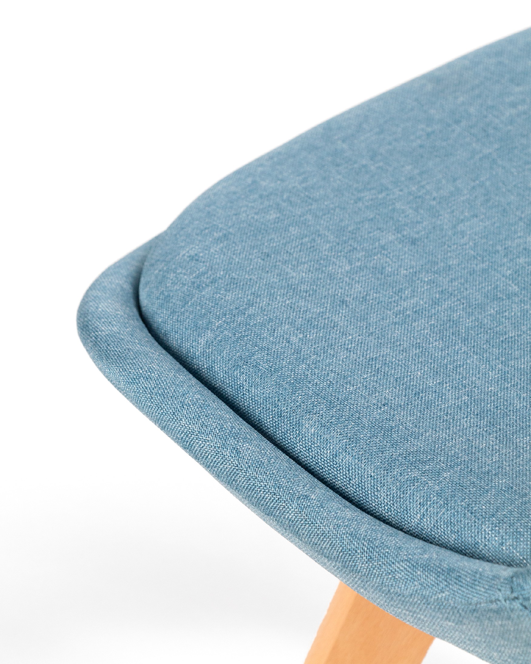 Amsterdam chair with blue upholstery and wooden legs