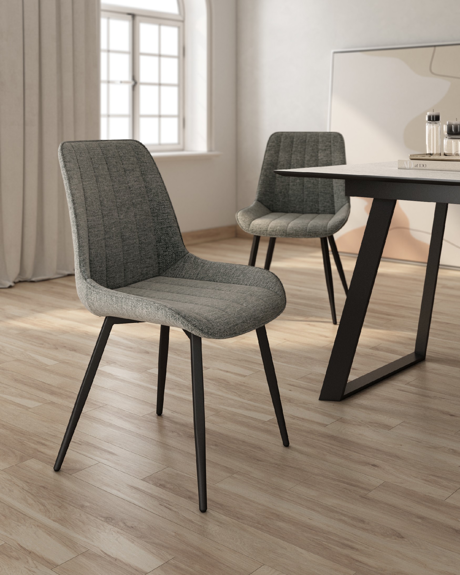 Ankara chair with gray upholstery and black legs