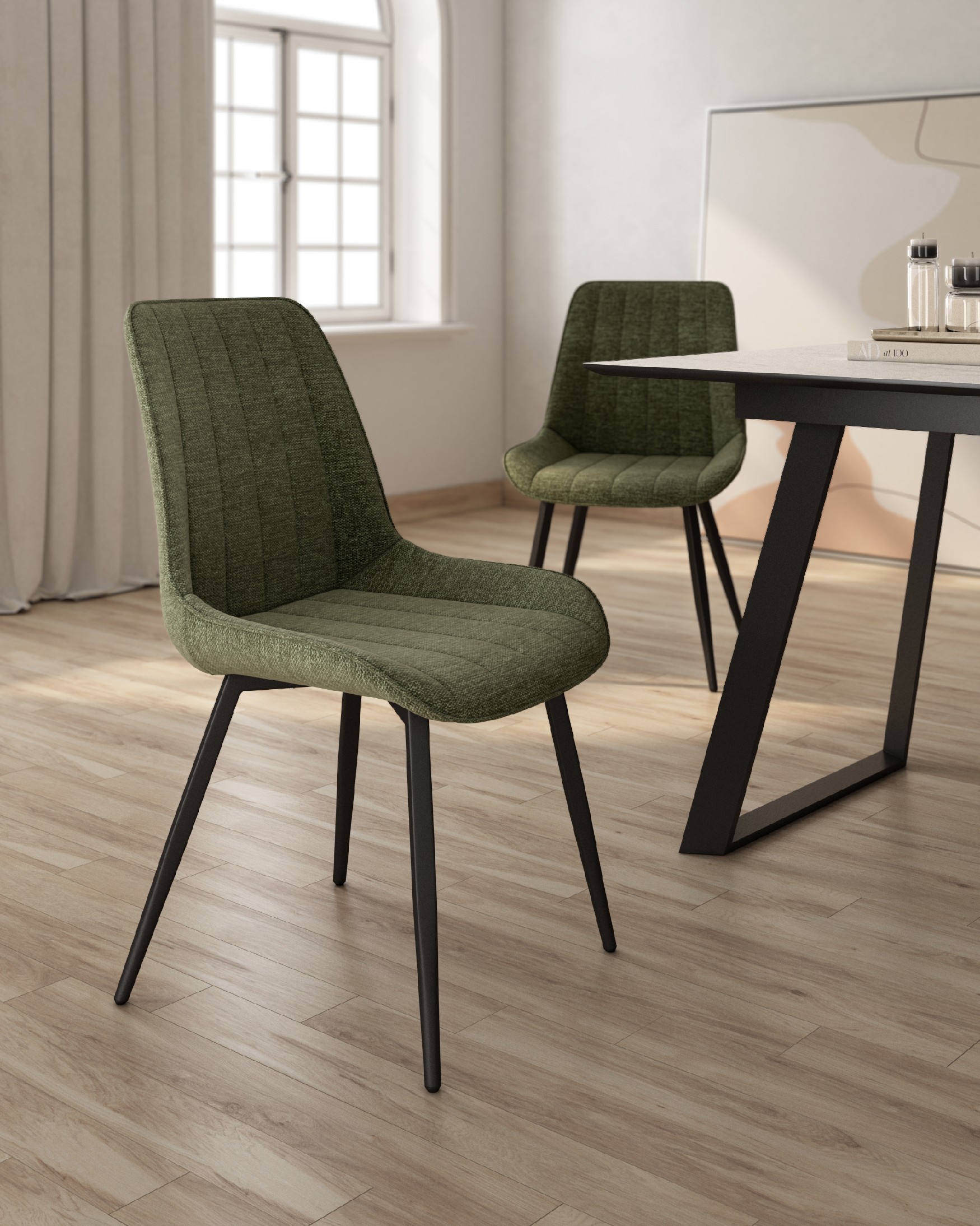 Ankara chair with green upholstery and black legs