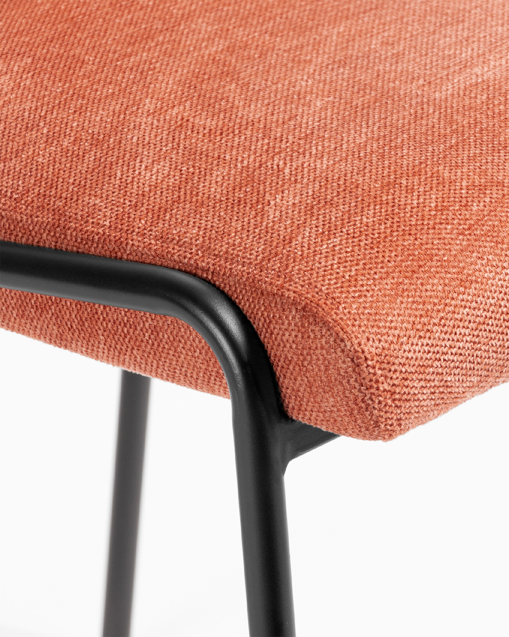 Atlanta chair with salmon upholstery and black metal legs
