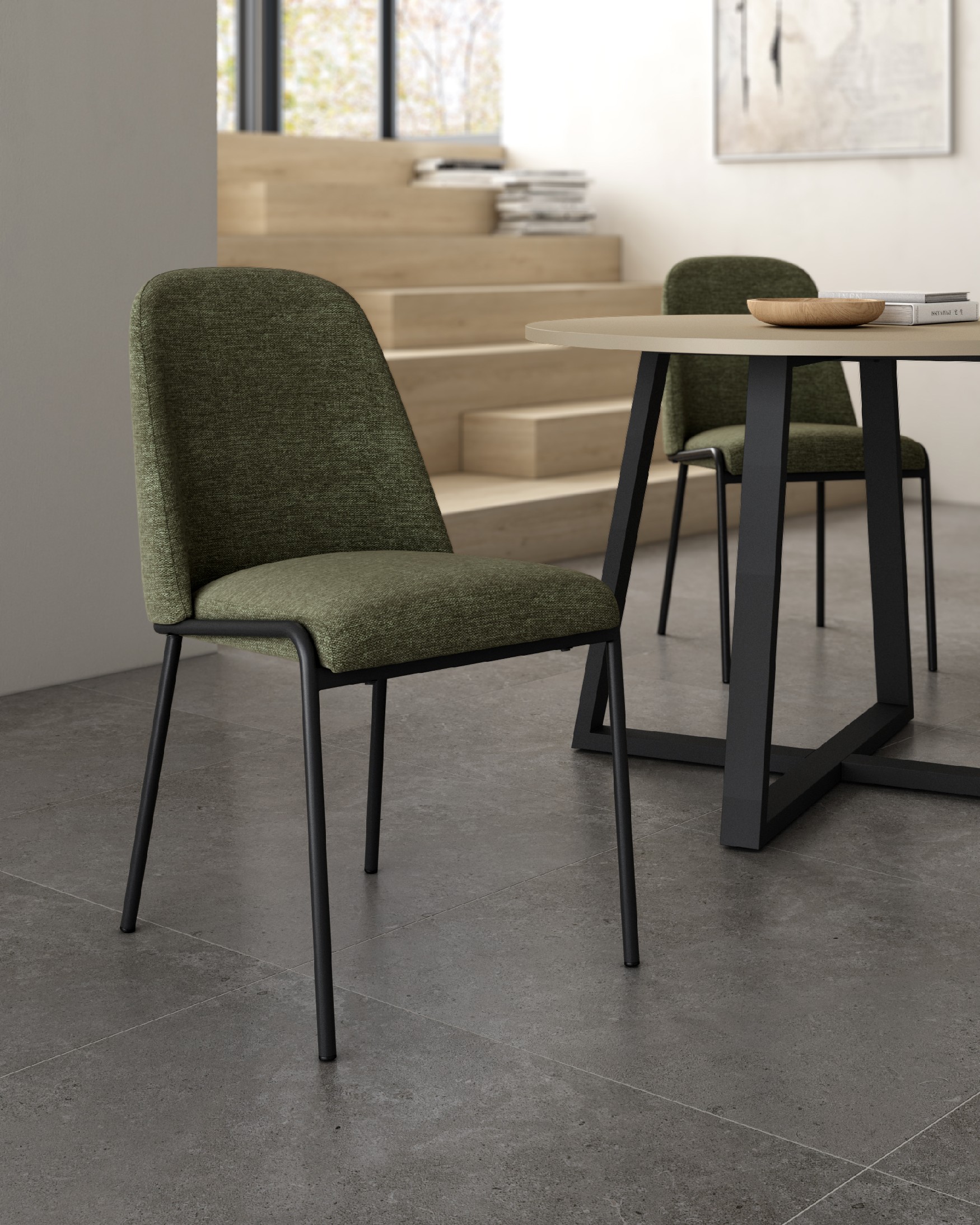 Atlanta chair with green upholstery and black metal legs