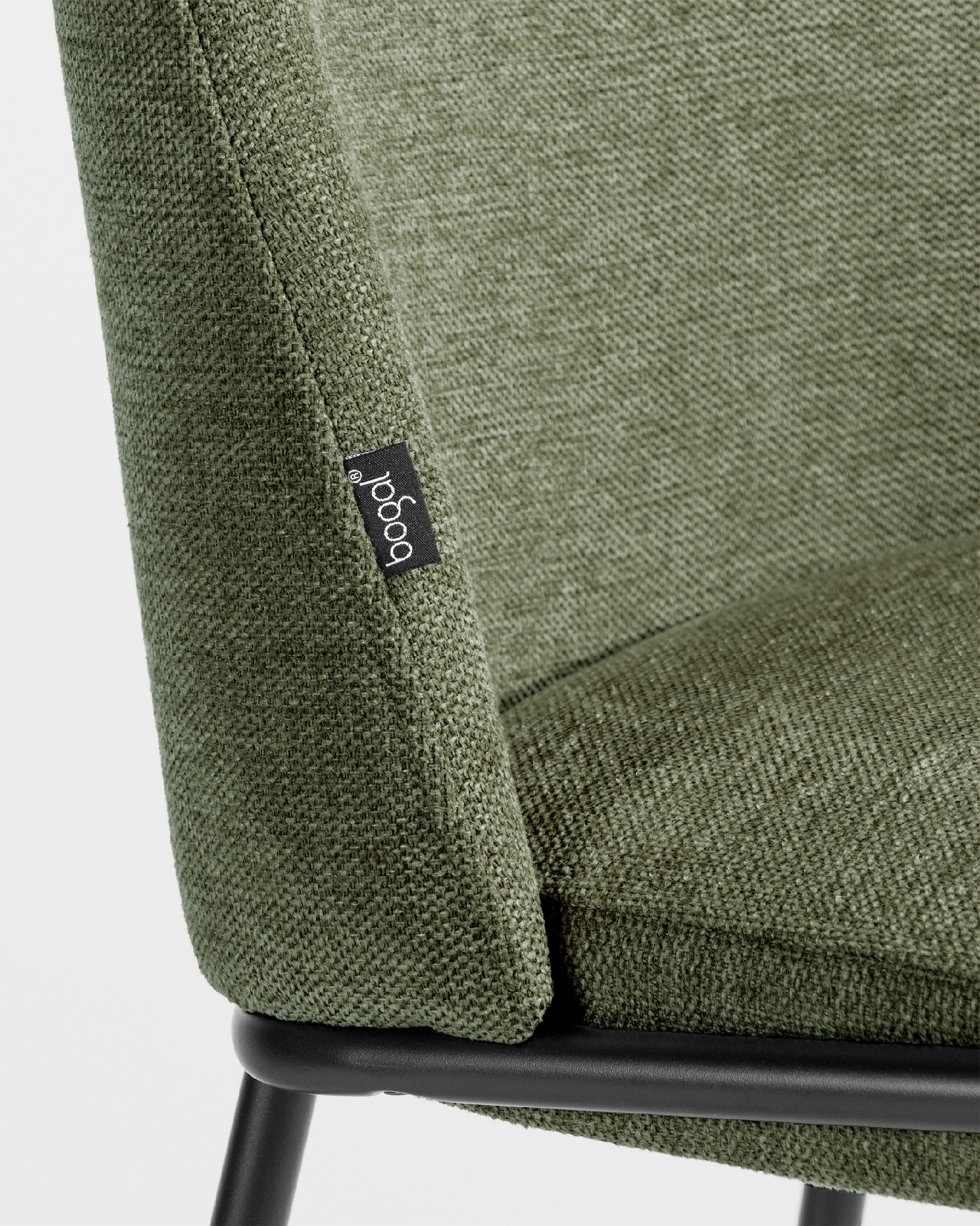 Atlanta chair with green upholstery and black metal legs