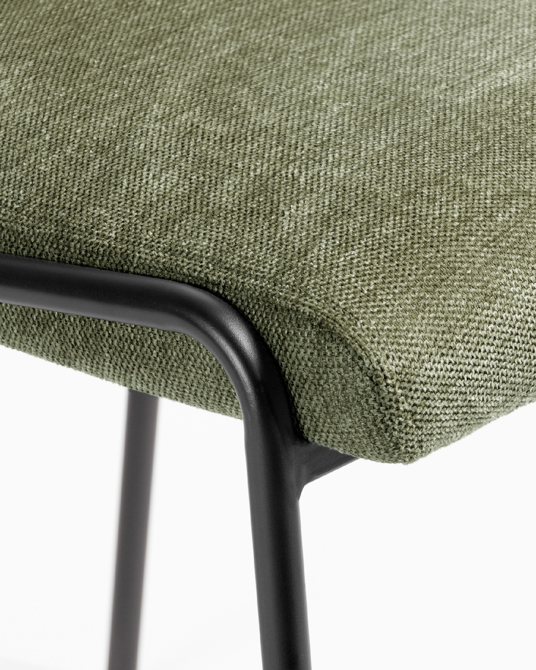 Atlanta chair with green upholstery and black metal legs