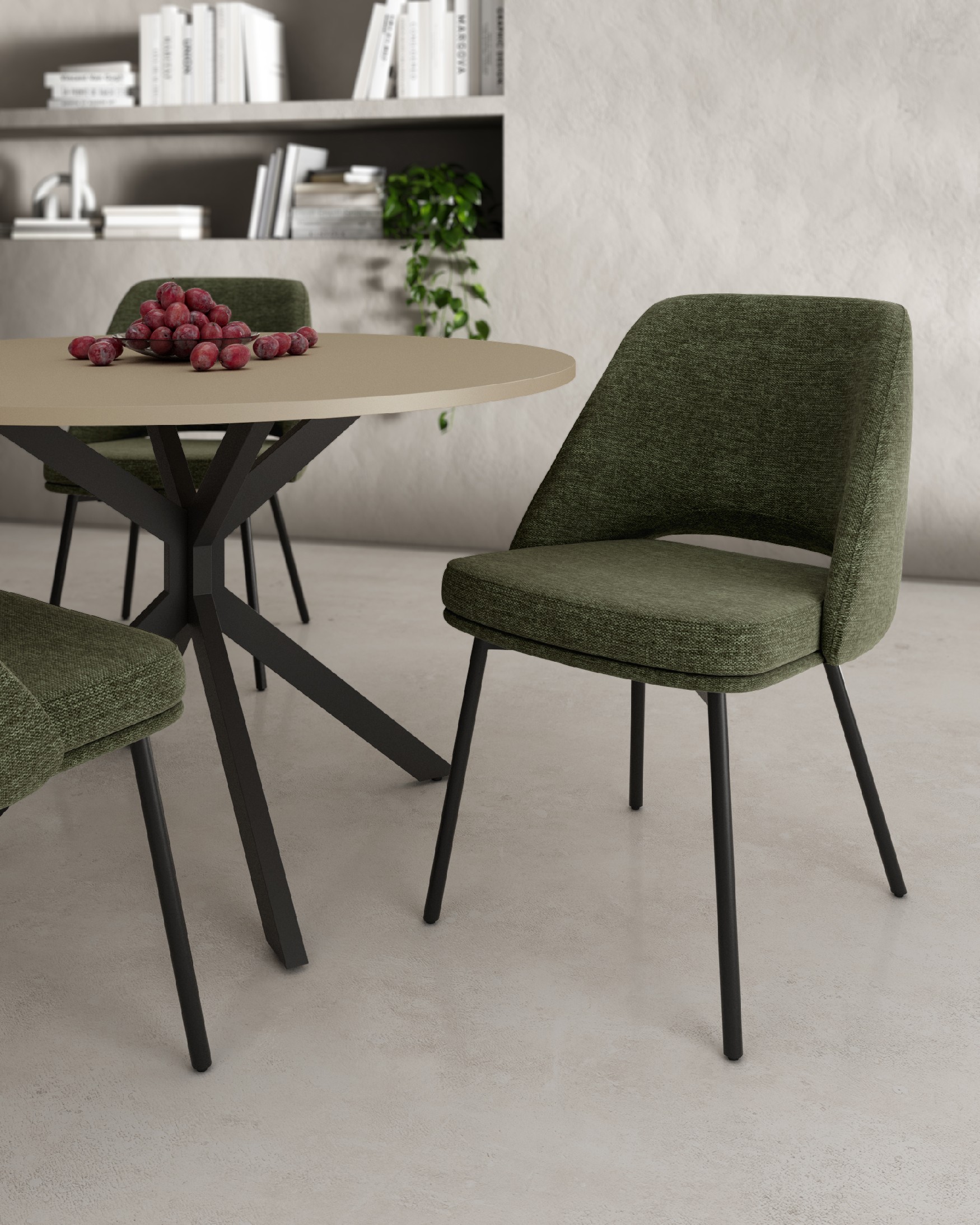 Beirut chair with green upholstery and black metal legs