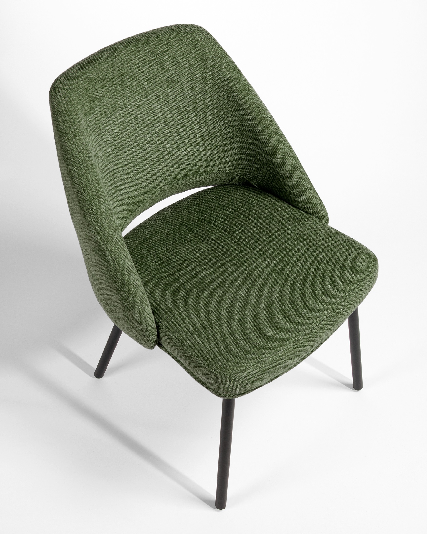 Beirut chair with green upholstery and black metal legs