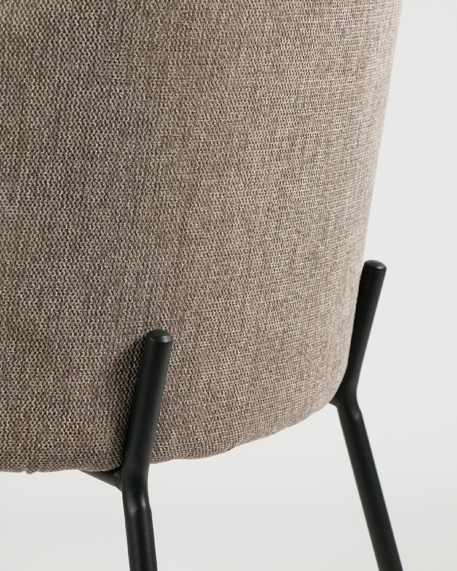 Bergen chair with brown upholstery and black metal legs