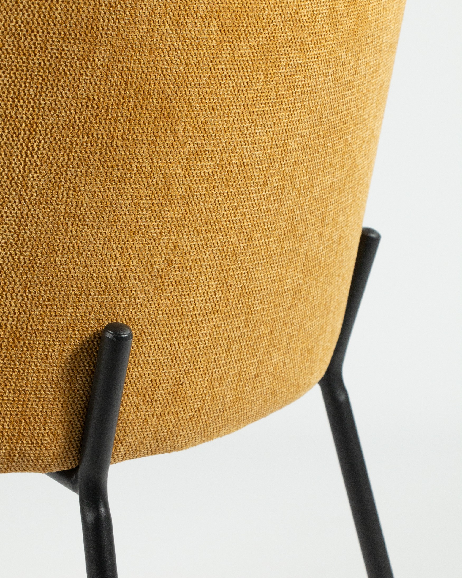Bergen chair with mustard upholstery and black metal legs
