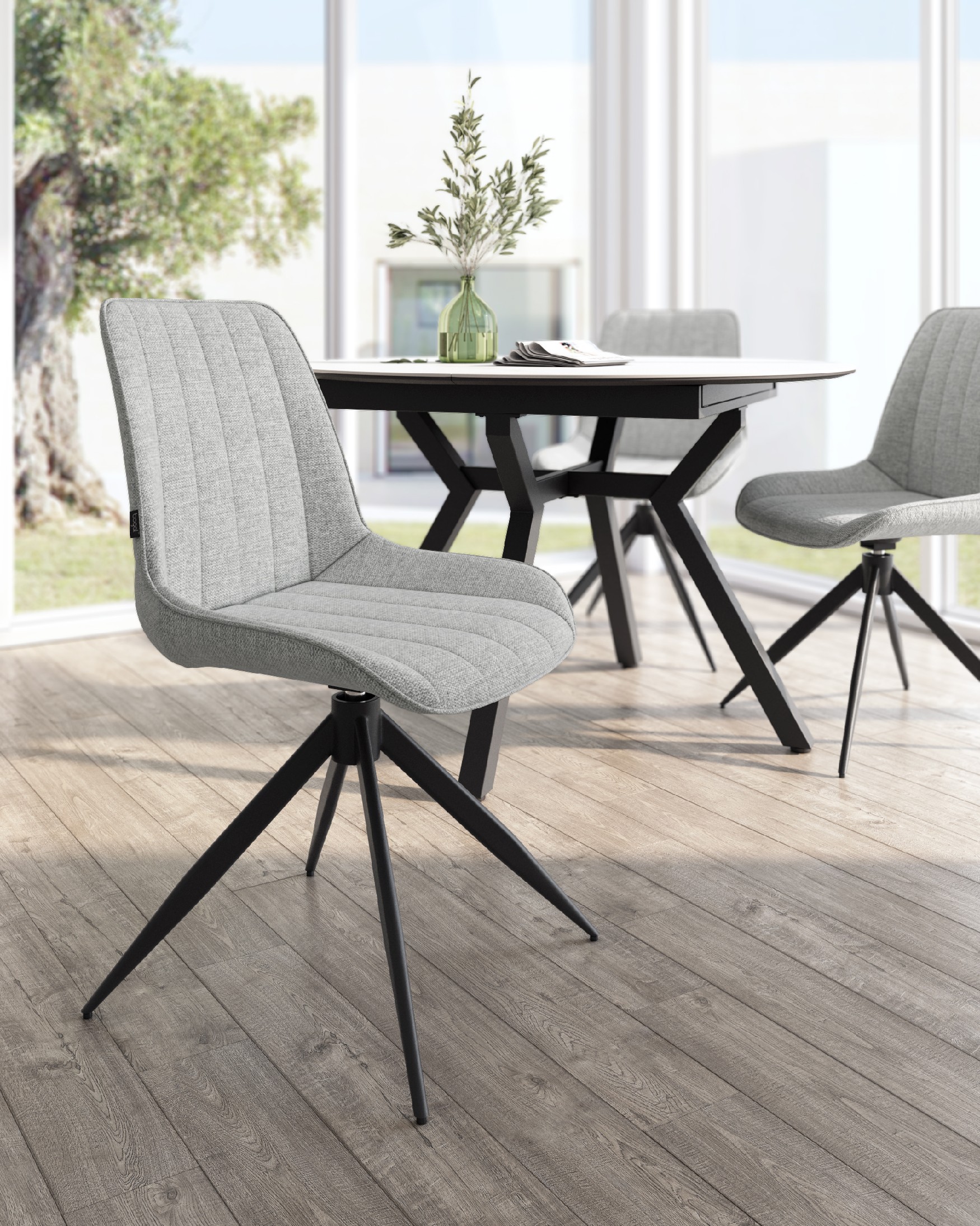 Silla Bursa giratoria 180º con función return, tapizado gris y patas metálicas negras