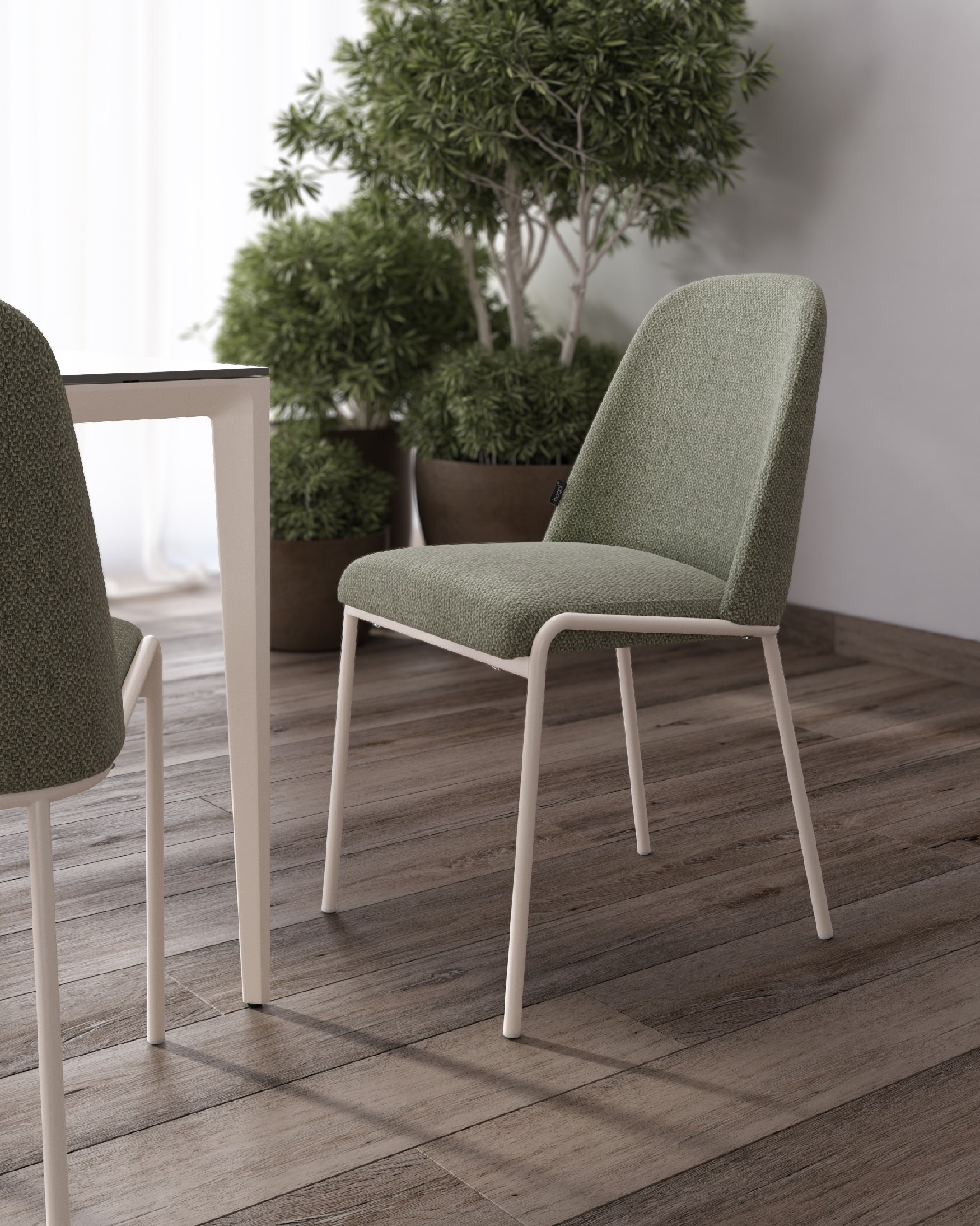 Chaise Calgary avec un revêtement vert et des pieds métalliques ivoire