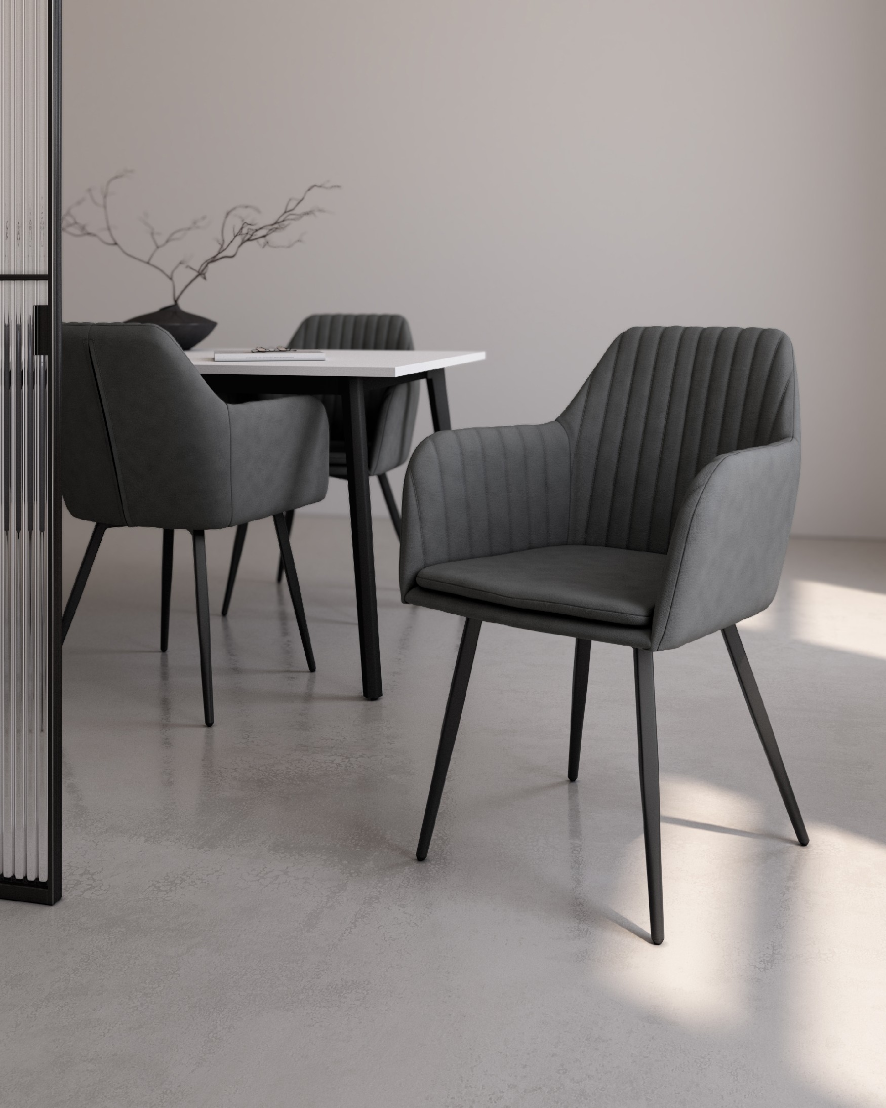 Chicago chair with dark gray upholstery and black metal legs