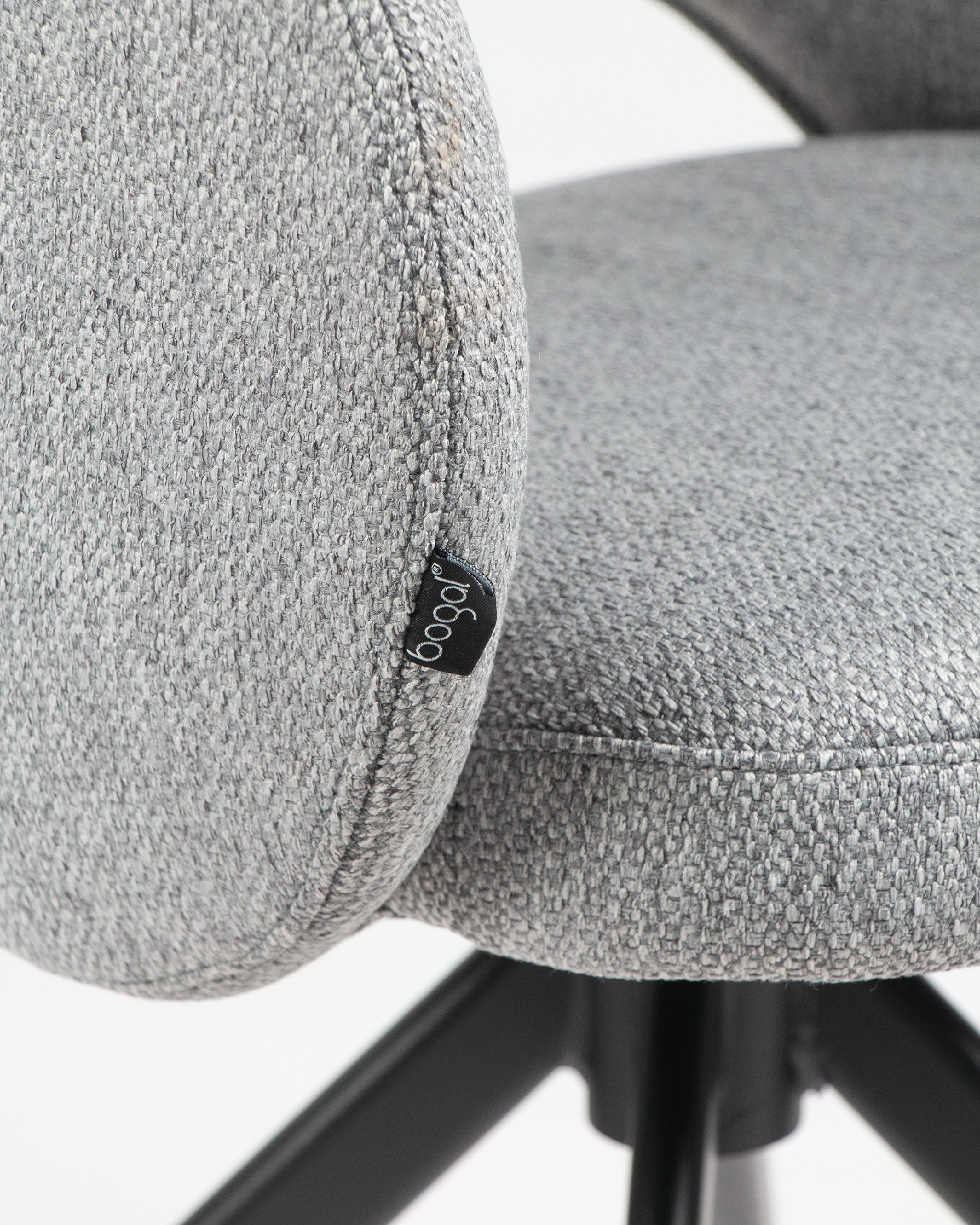Cork chair with gray upholstery and black metal legs
