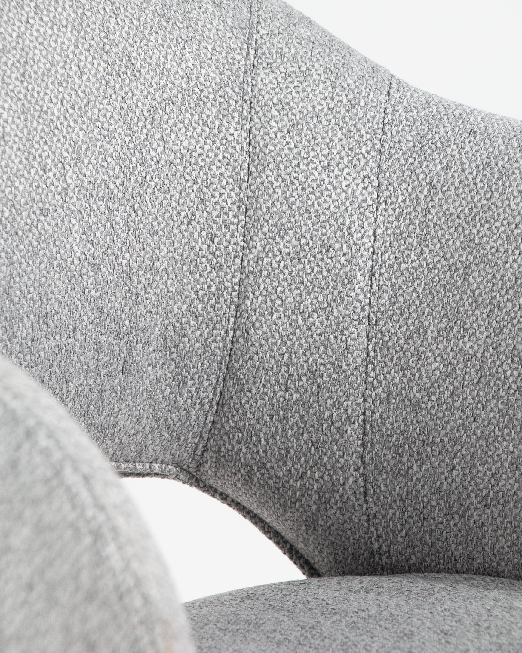 Cork chair with gray upholstery and black metal legs