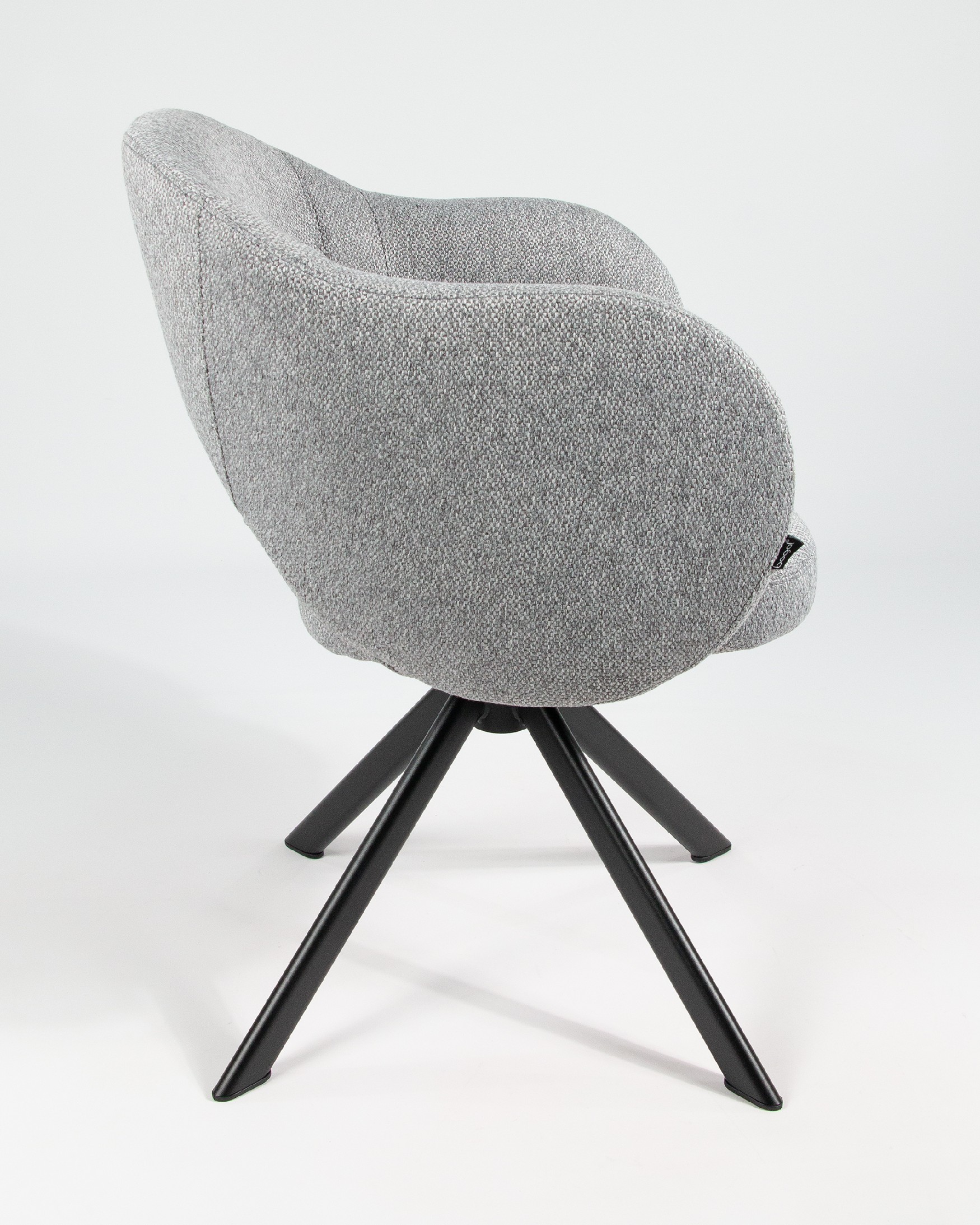 Cork chair with gray upholstery and black metal legs