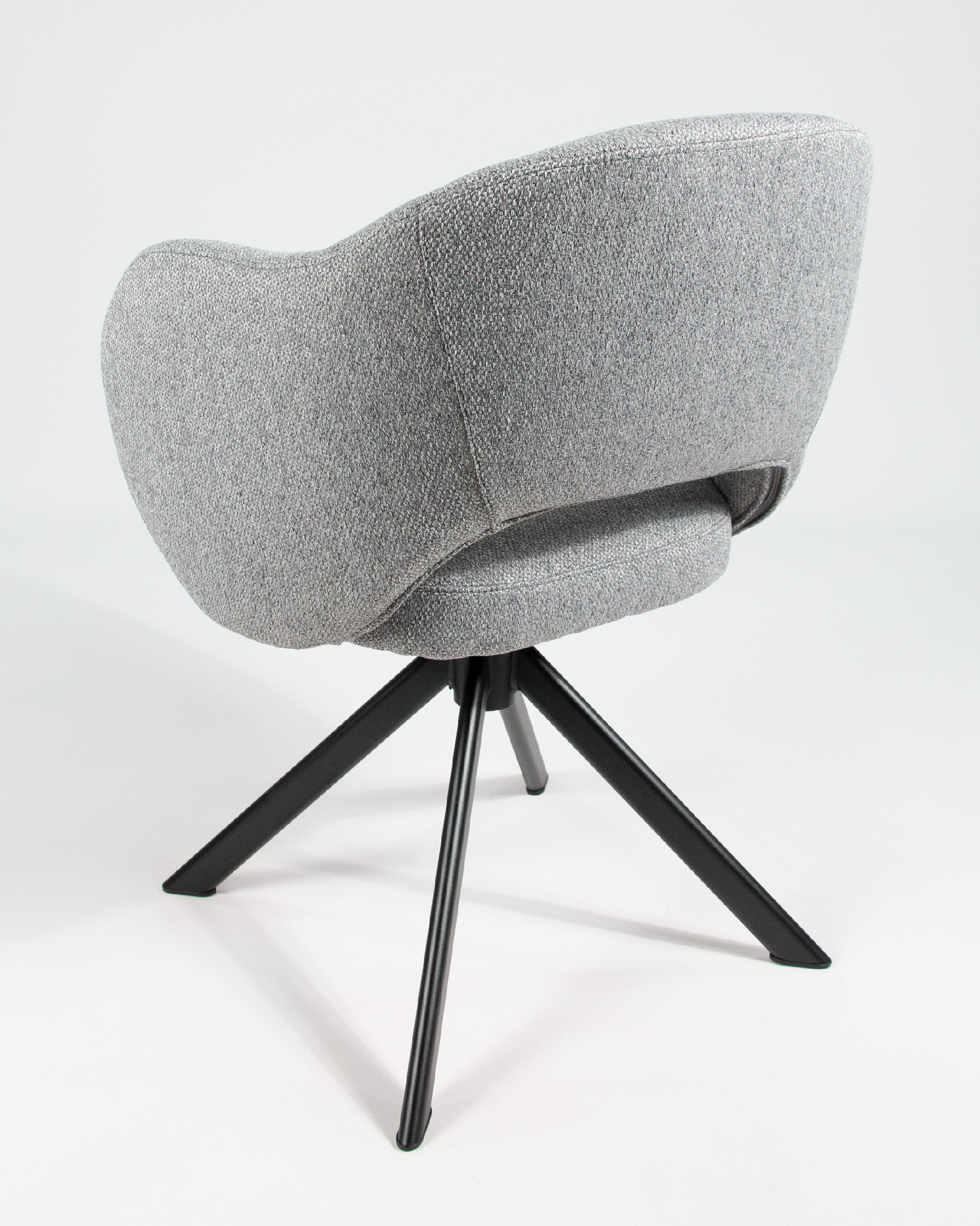 Cork chair with gray upholstery and black metal legs