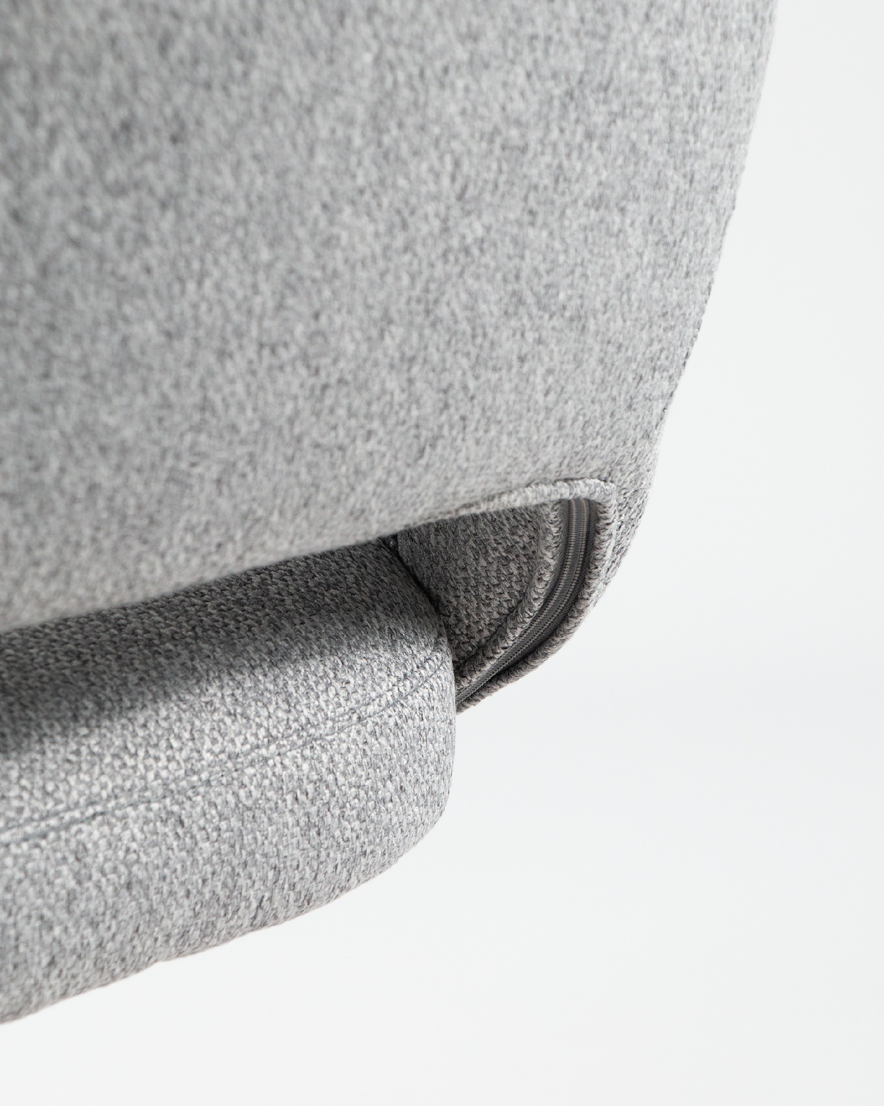 Cork chair with gray upholstery and black metal legs