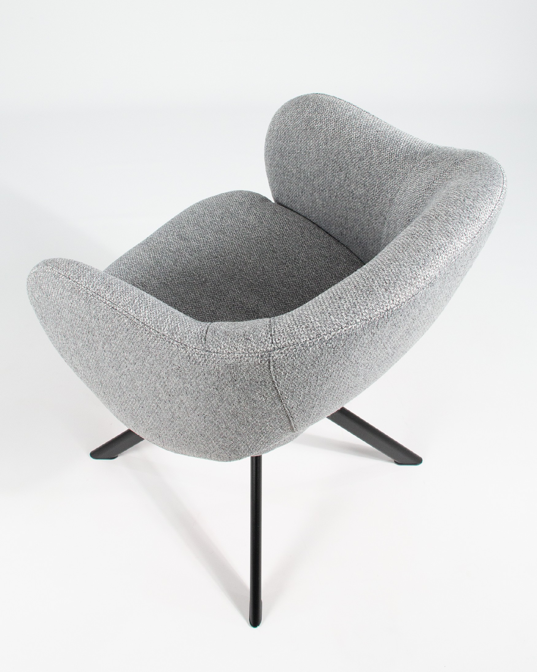 Cork chair with gray upholstery and black metal legs