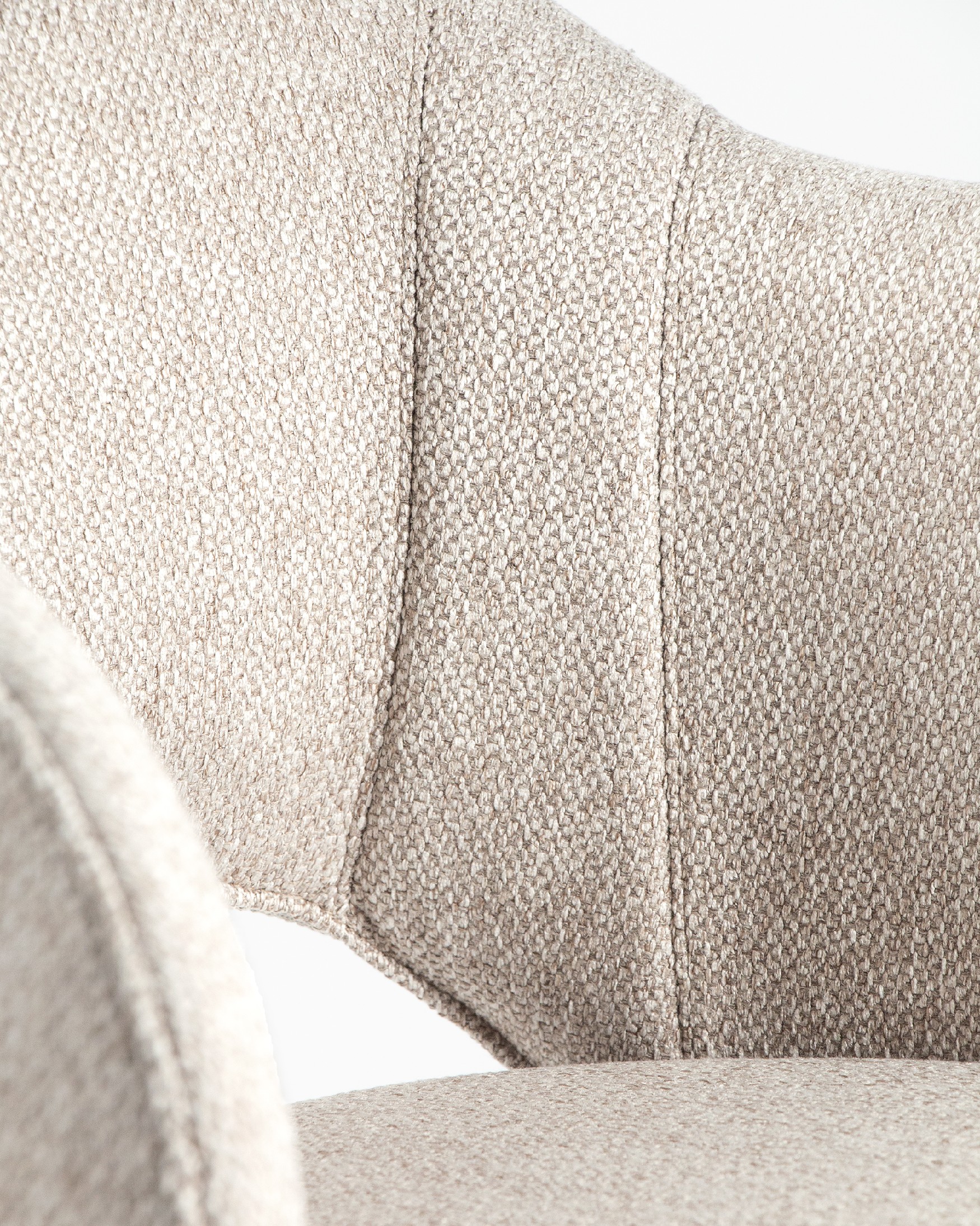 Cork chair with brown upholstery and black metal legs