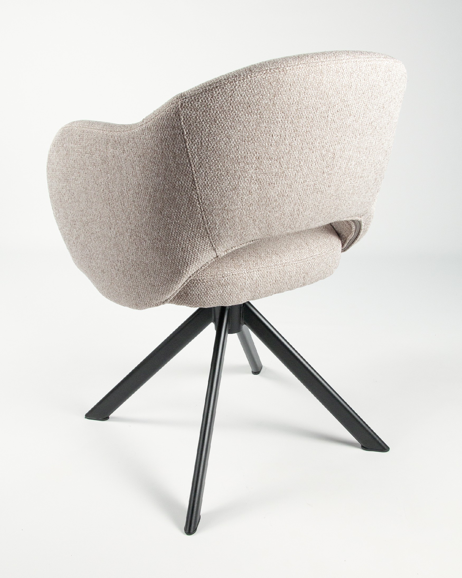 Cork chair with brown upholstery and black metal legs