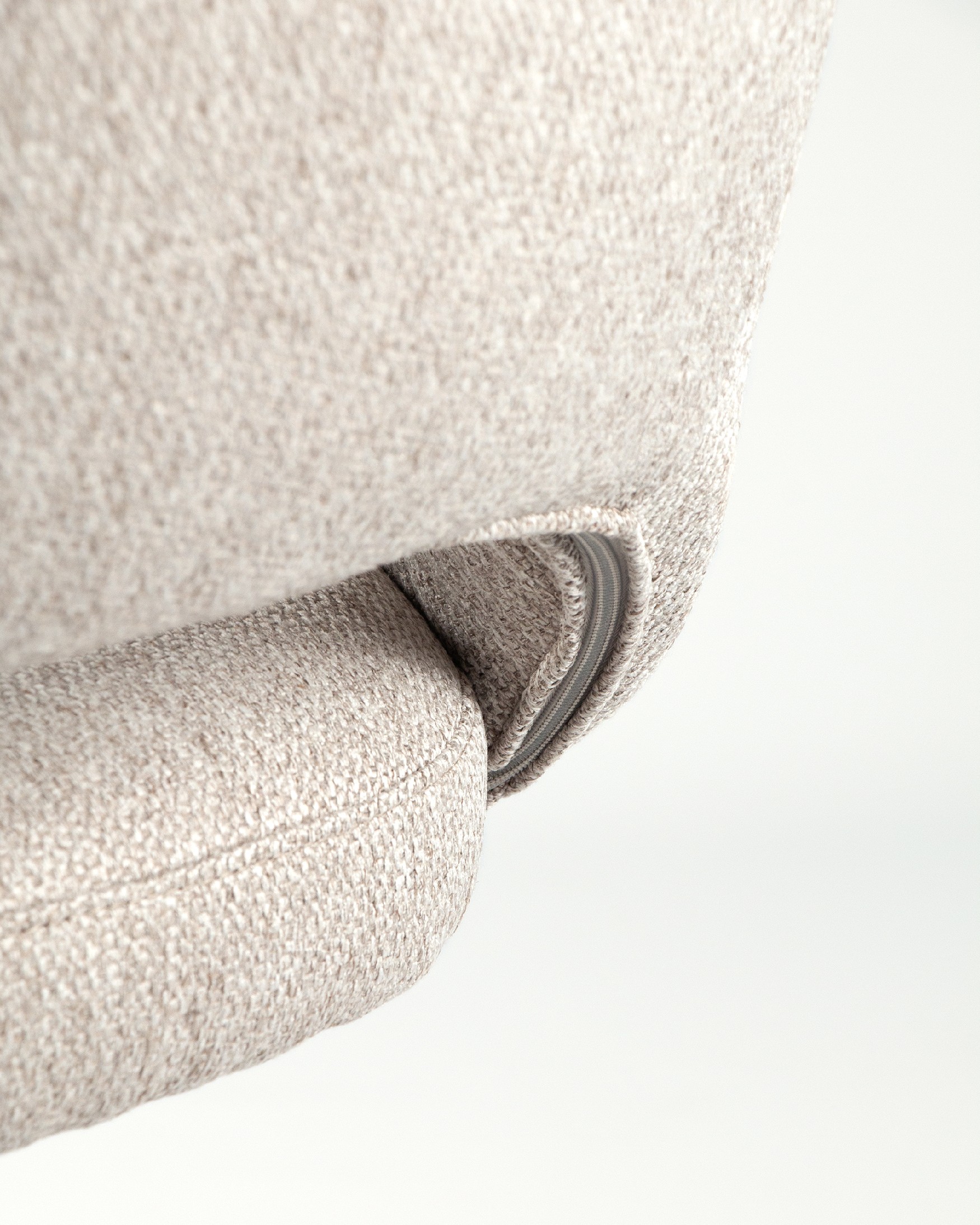 Cork chair with brown upholstery and black metal legs