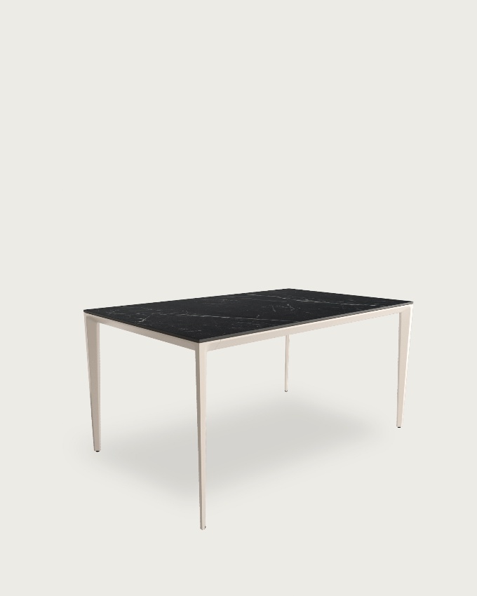 Cortes table with porcelain finish in Marquina and ivory metal leg 140 x 90 cm