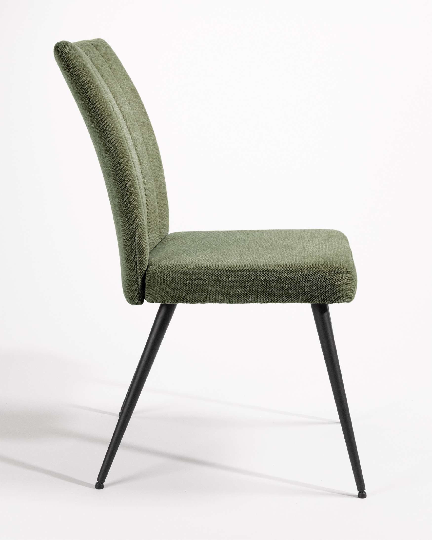 Dallas chair with green upholstery and black metal legs