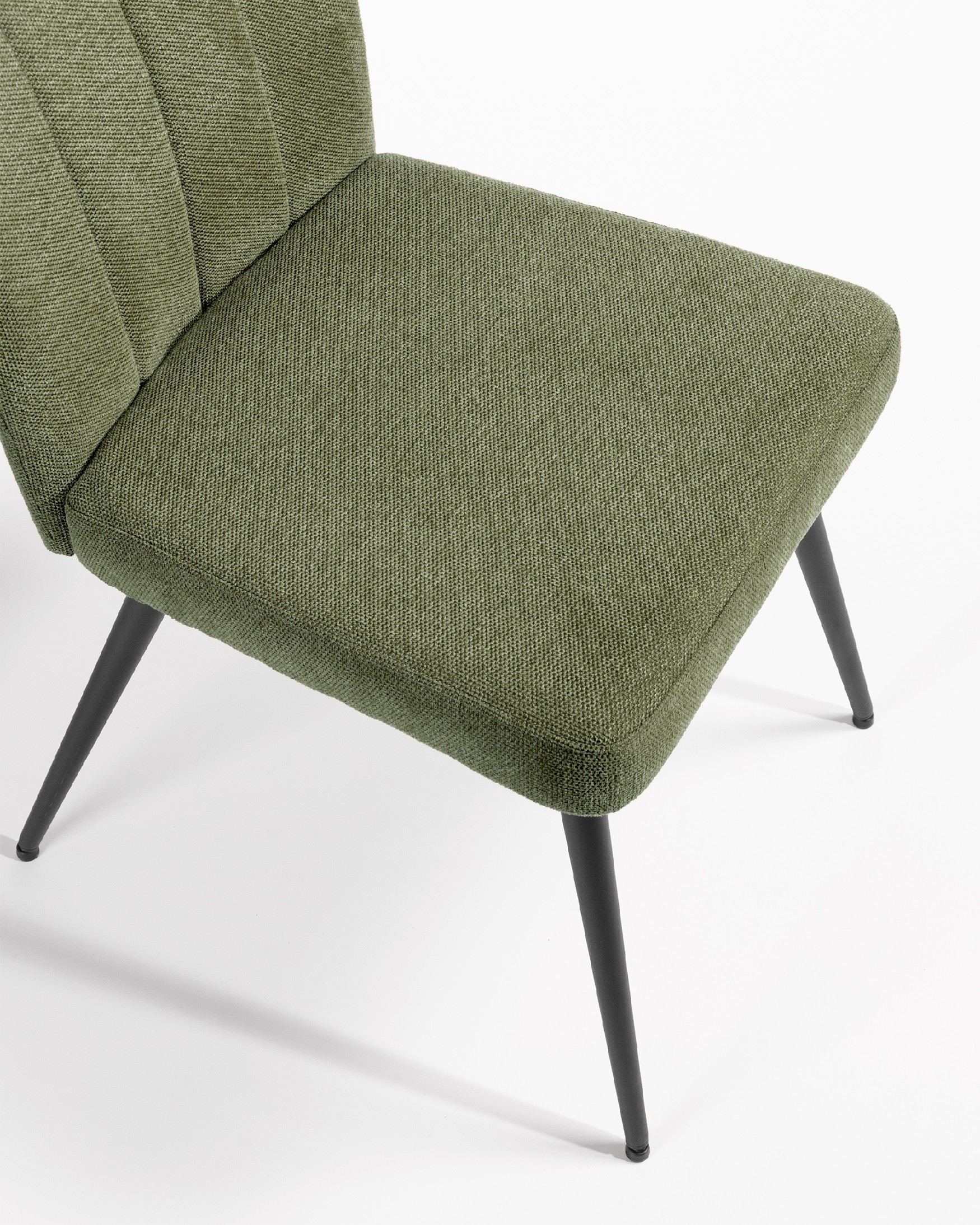 Dallas chair with green upholstery and black metal legs
