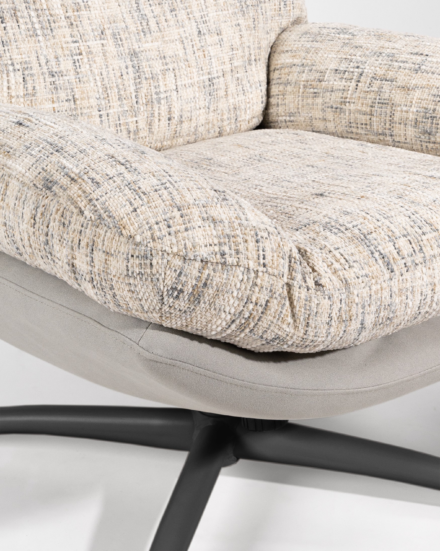 Denia armchair with pearl and cloud upholstery and black metal structure ottoman, 360° swivel rocking.