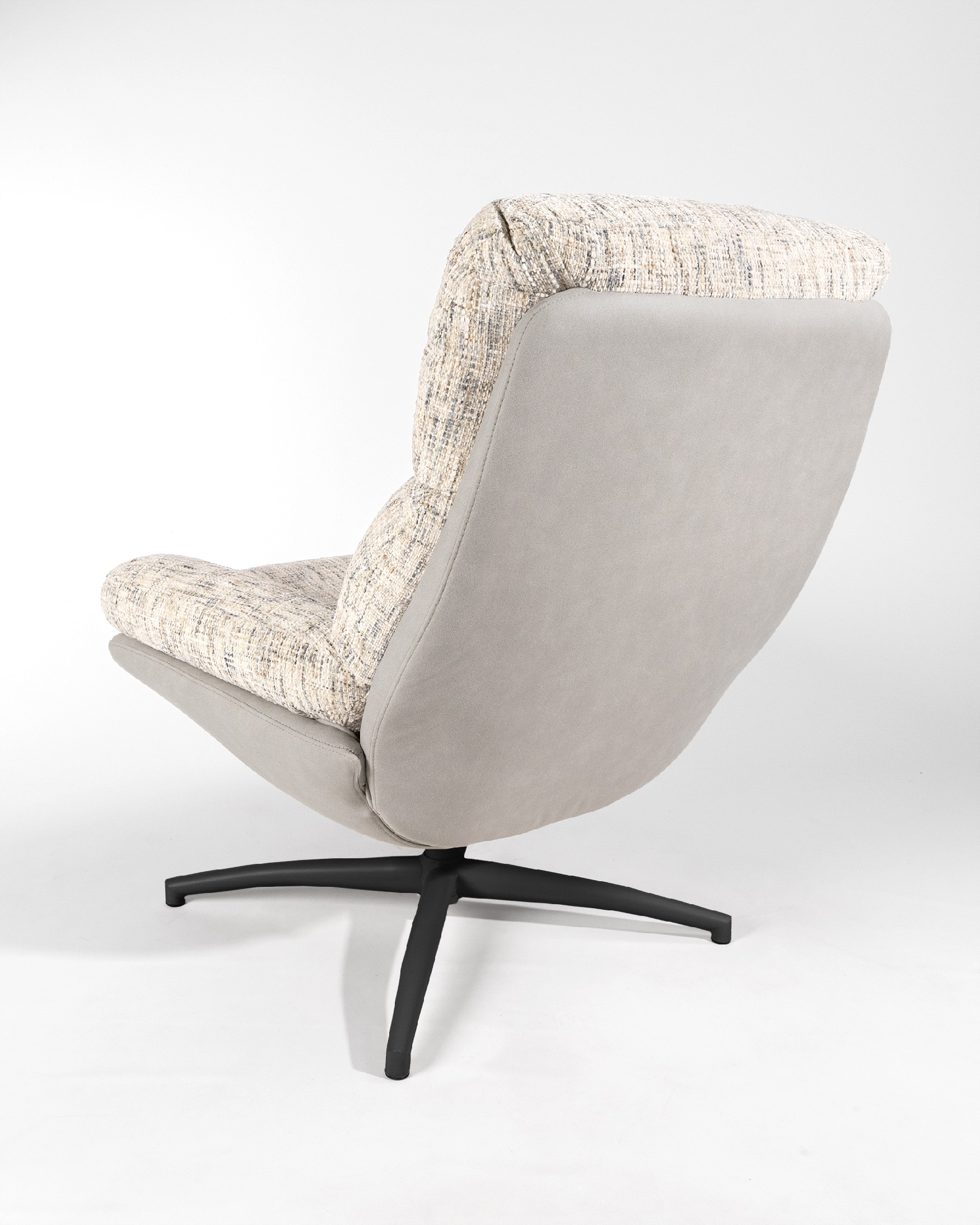 Denia armchair with pearl and cloud upholstery and black metal structure ottoman, 360° swivel rocking.