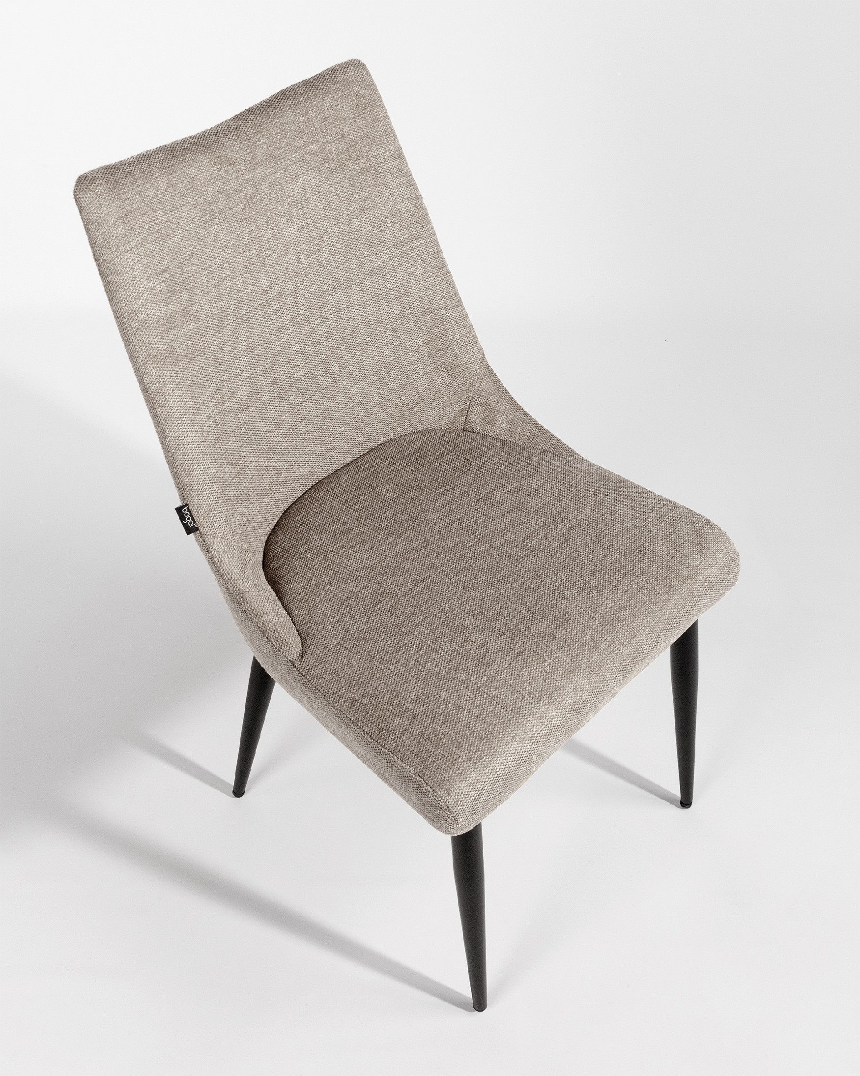 Denver chair with brown upholstery and black metal legs