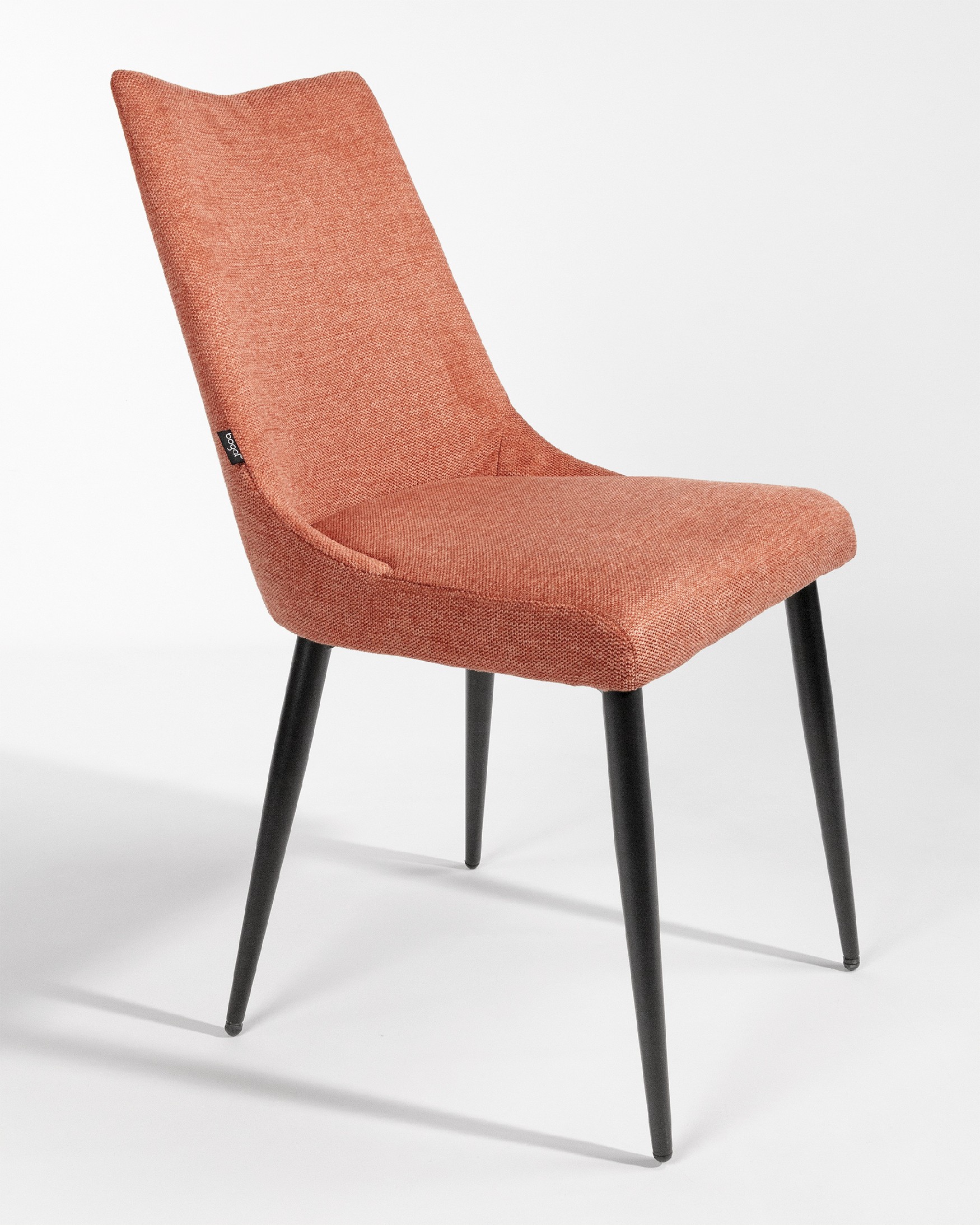 Denver chair with salmon upholstery and black metal legs