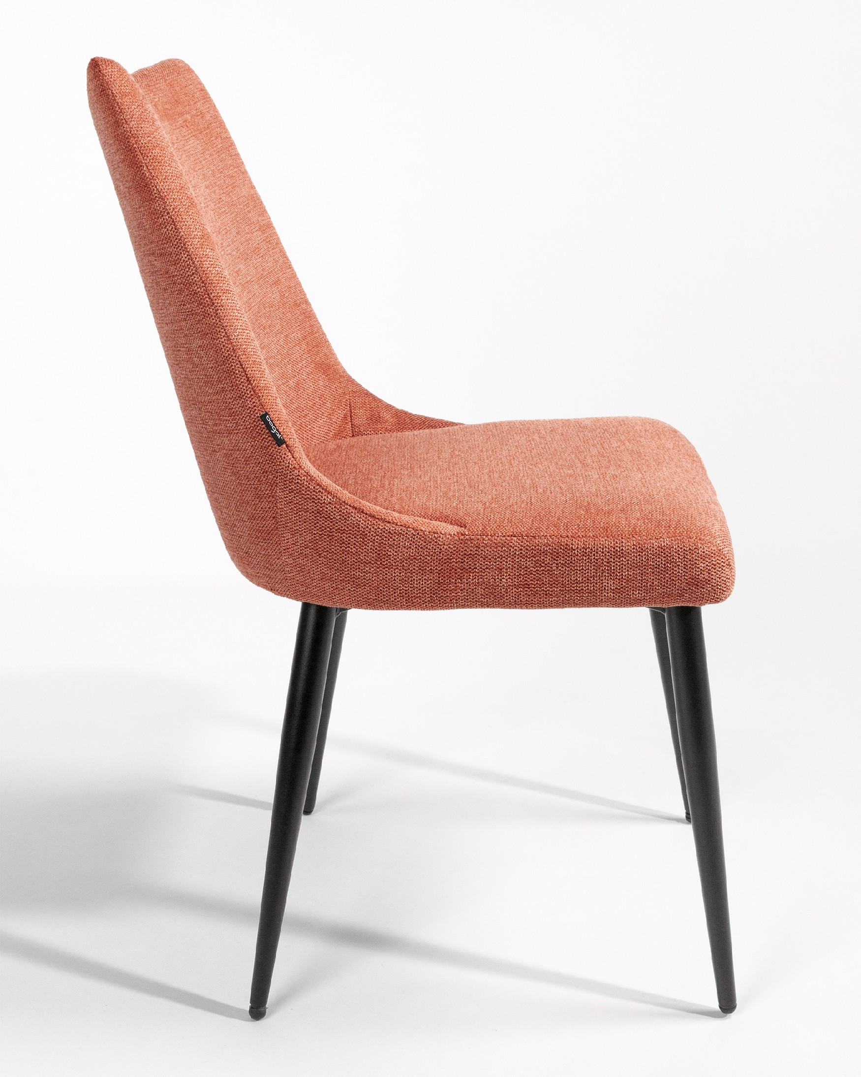 Denver chair with salmon upholstery and black metal legs