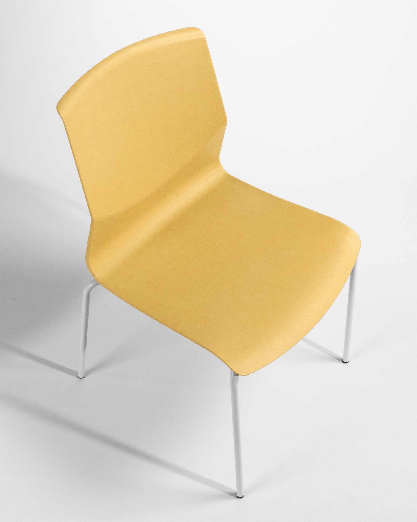mustard polypropylene Derby chair with white metal legs
