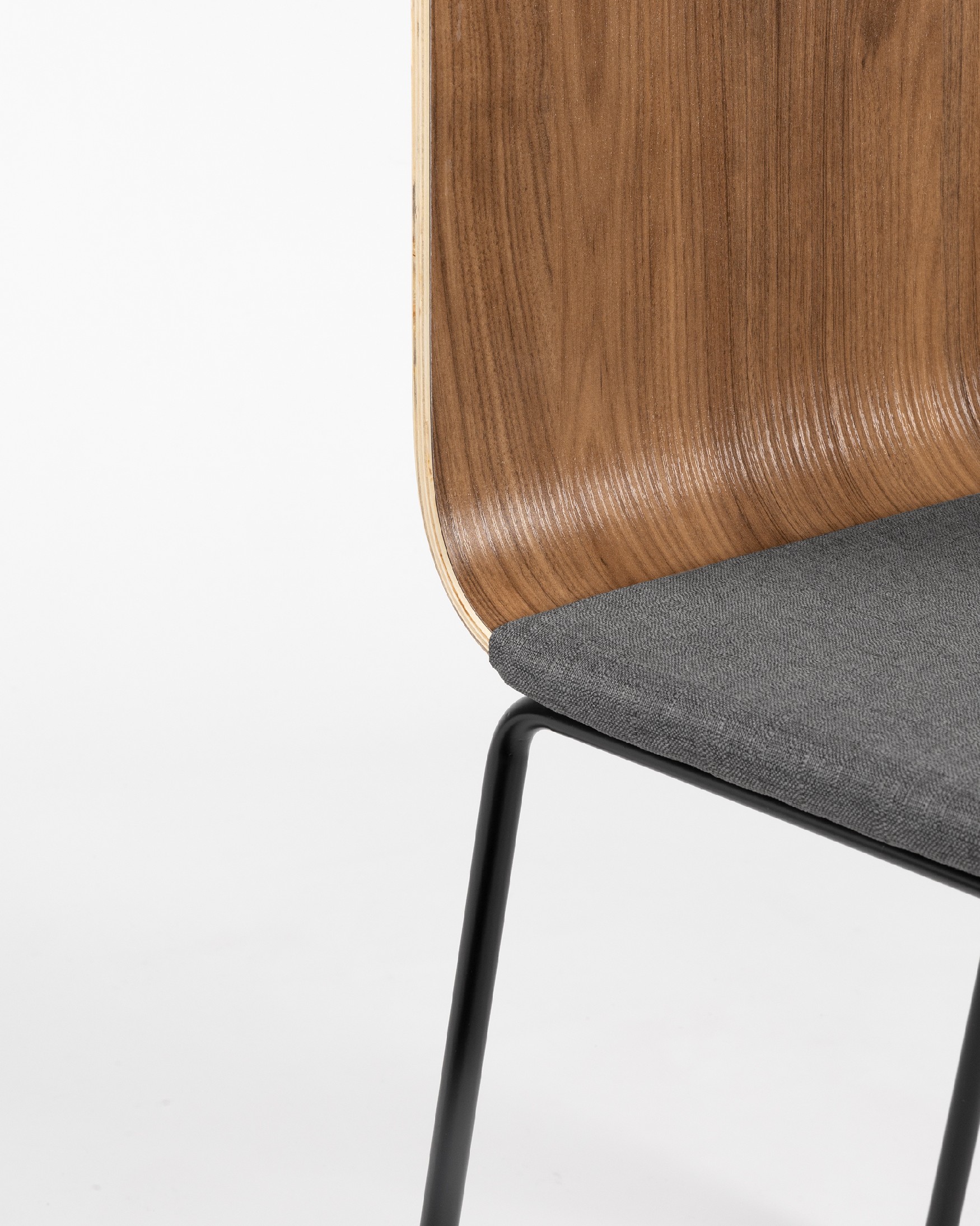 Dubai chair with gray upholstery, java backrest, and black metal legs