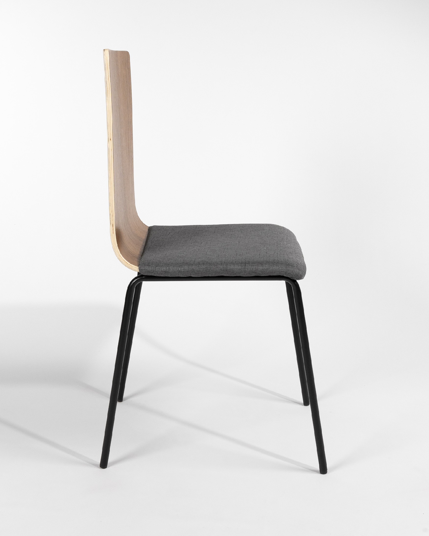 Dubai chair with gray upholstery, java backrest, and black metal legs